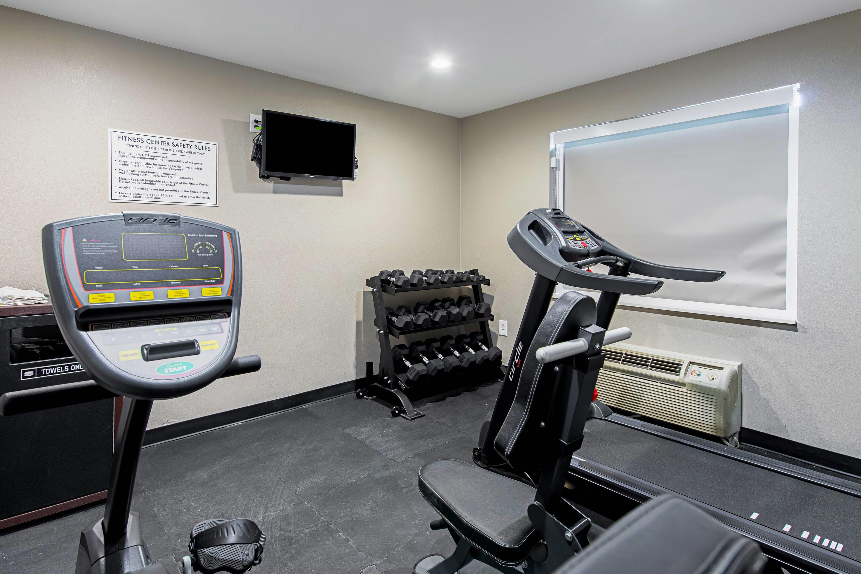 Exercise room with cardio equipment and weights | Quality Inn Mishawaka near Notre Dame