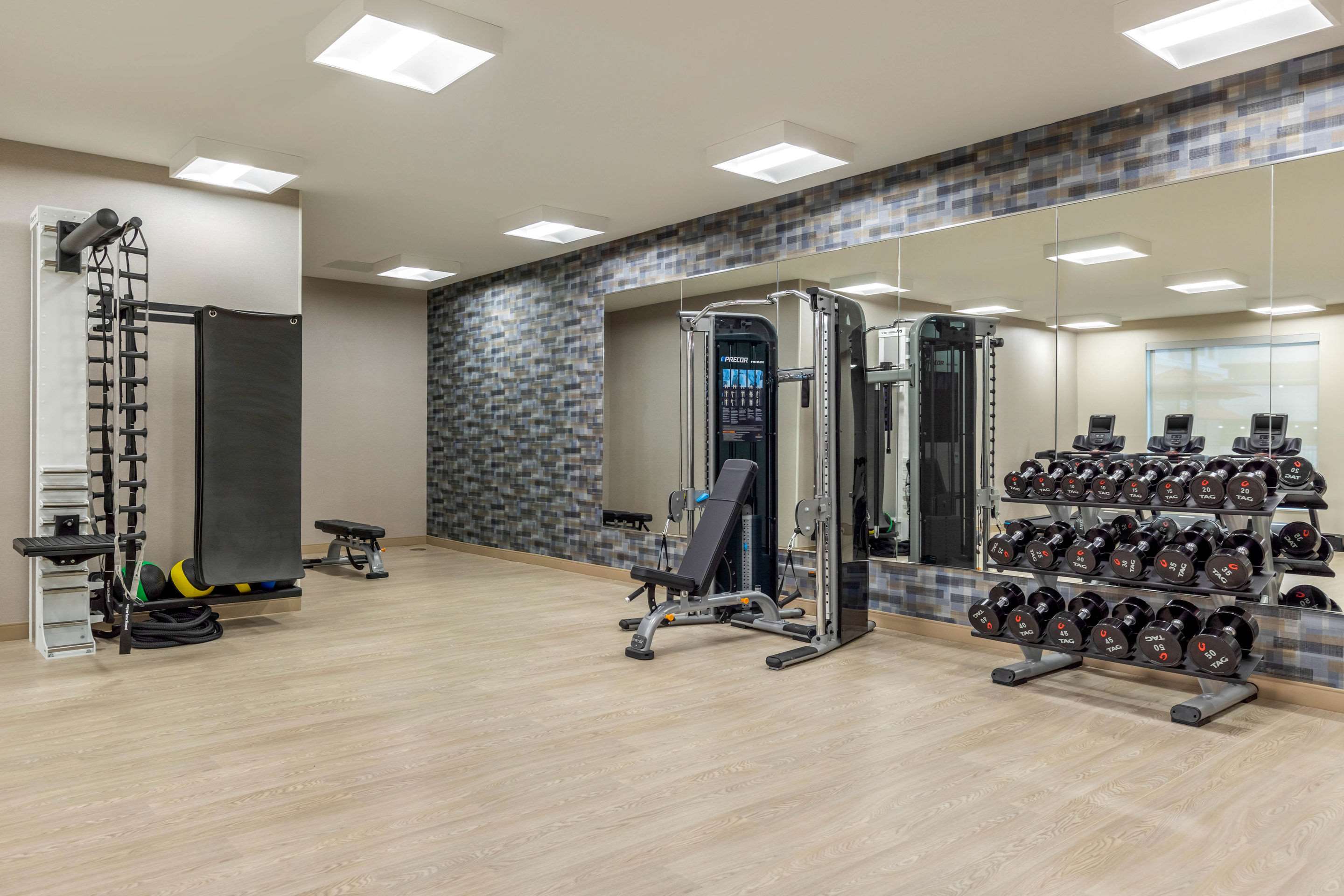 Exercise room with cardio equipment and weights | Cambria Hotel Milwaukee Downtown