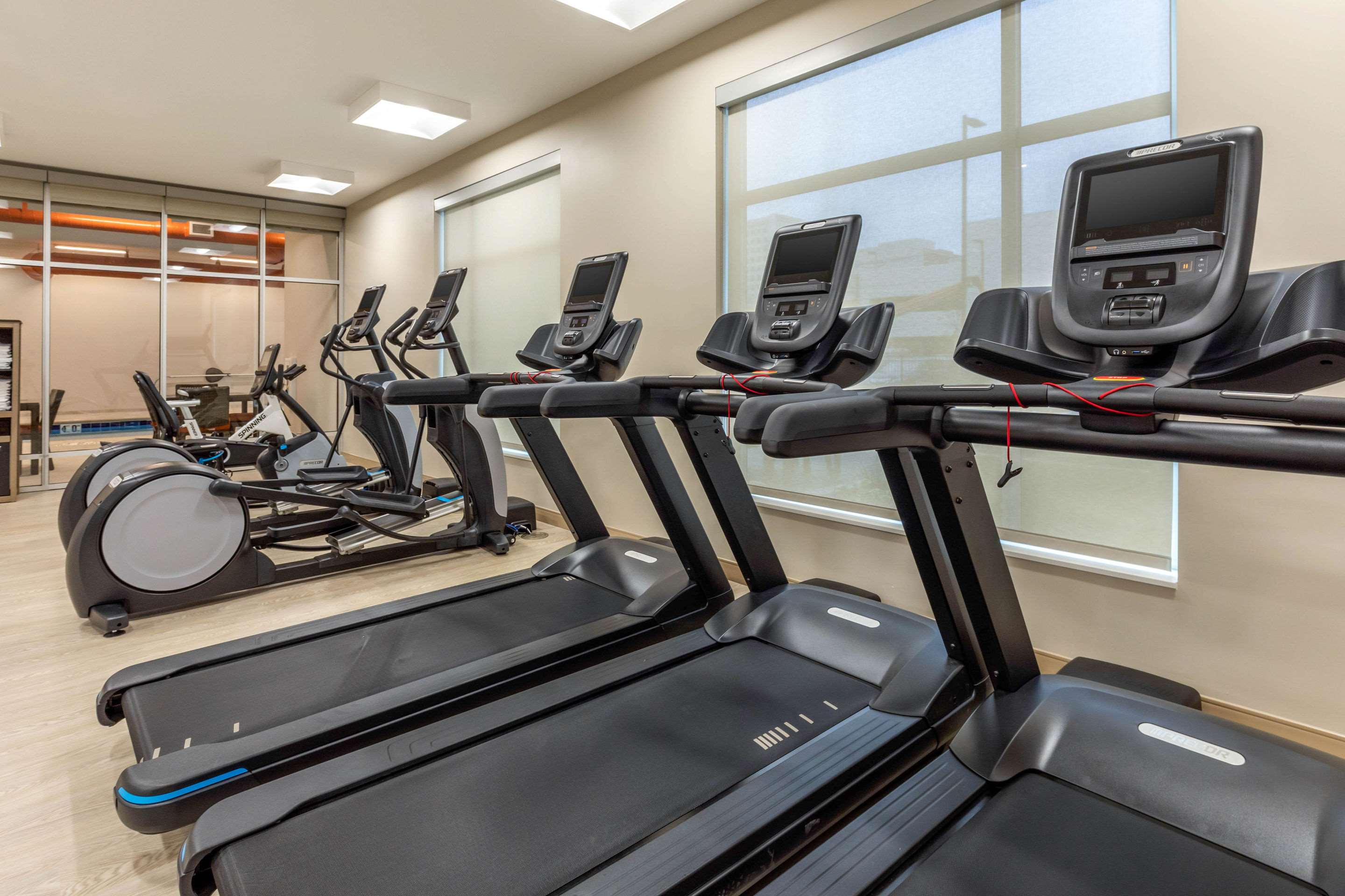 Exercise room with cardio equipment and weights | Cambria Hotel Milwaukee Downtown