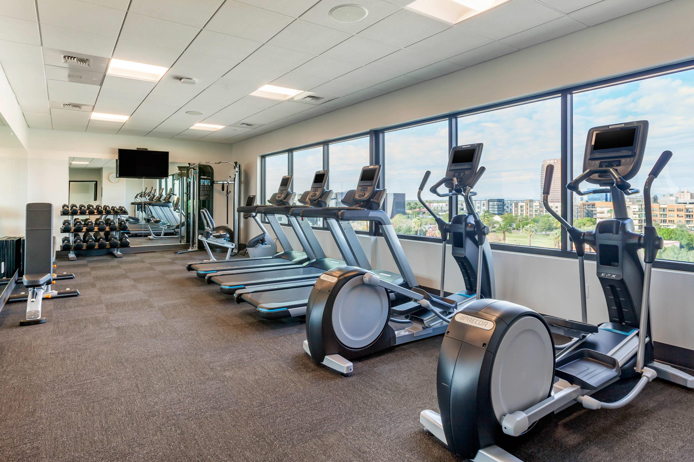 Exercise room with cardio equipment and weights | Cambria Hotel Downtown Phoenix Convention Center