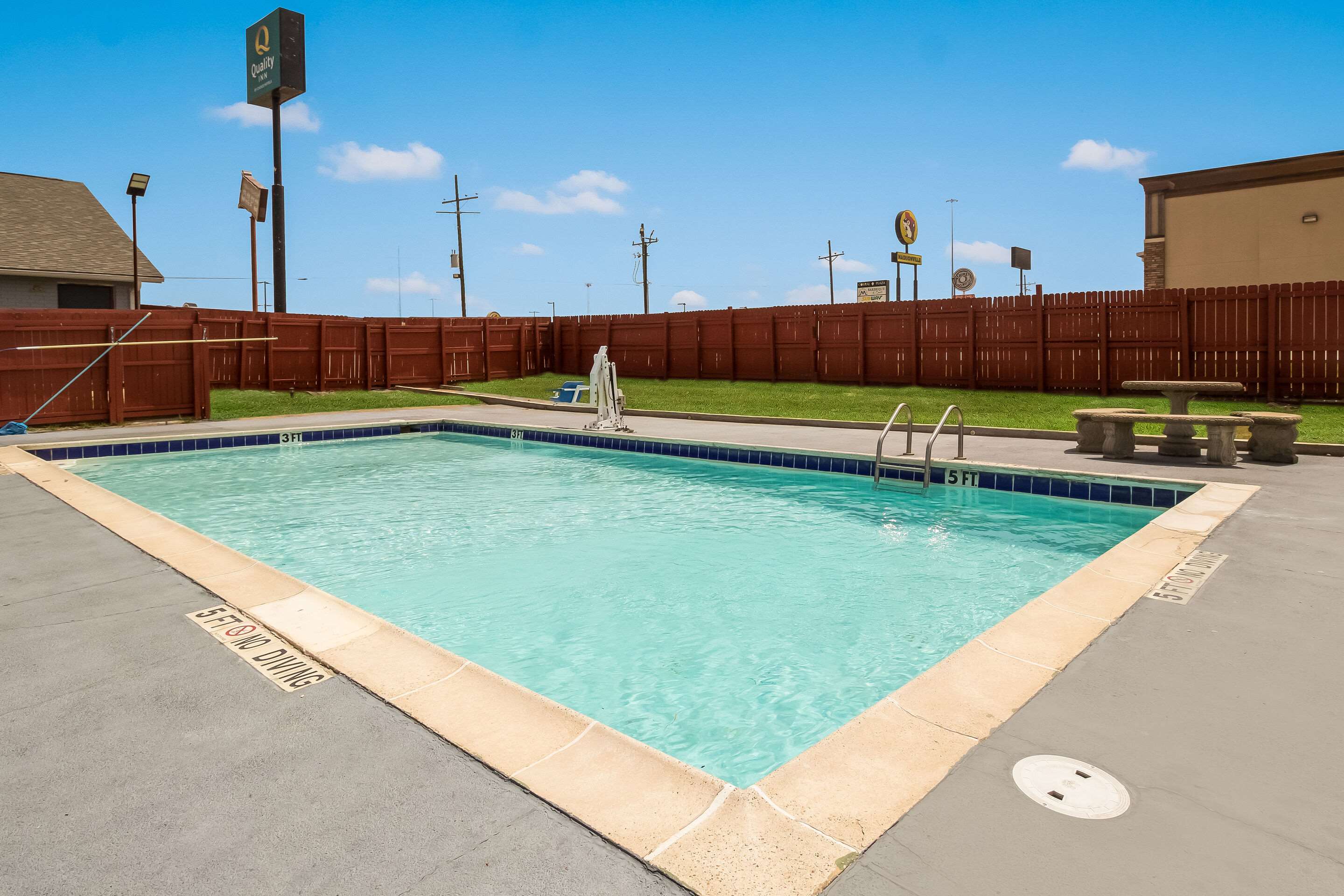 Outdoor pool | Quality Inn Madisonville