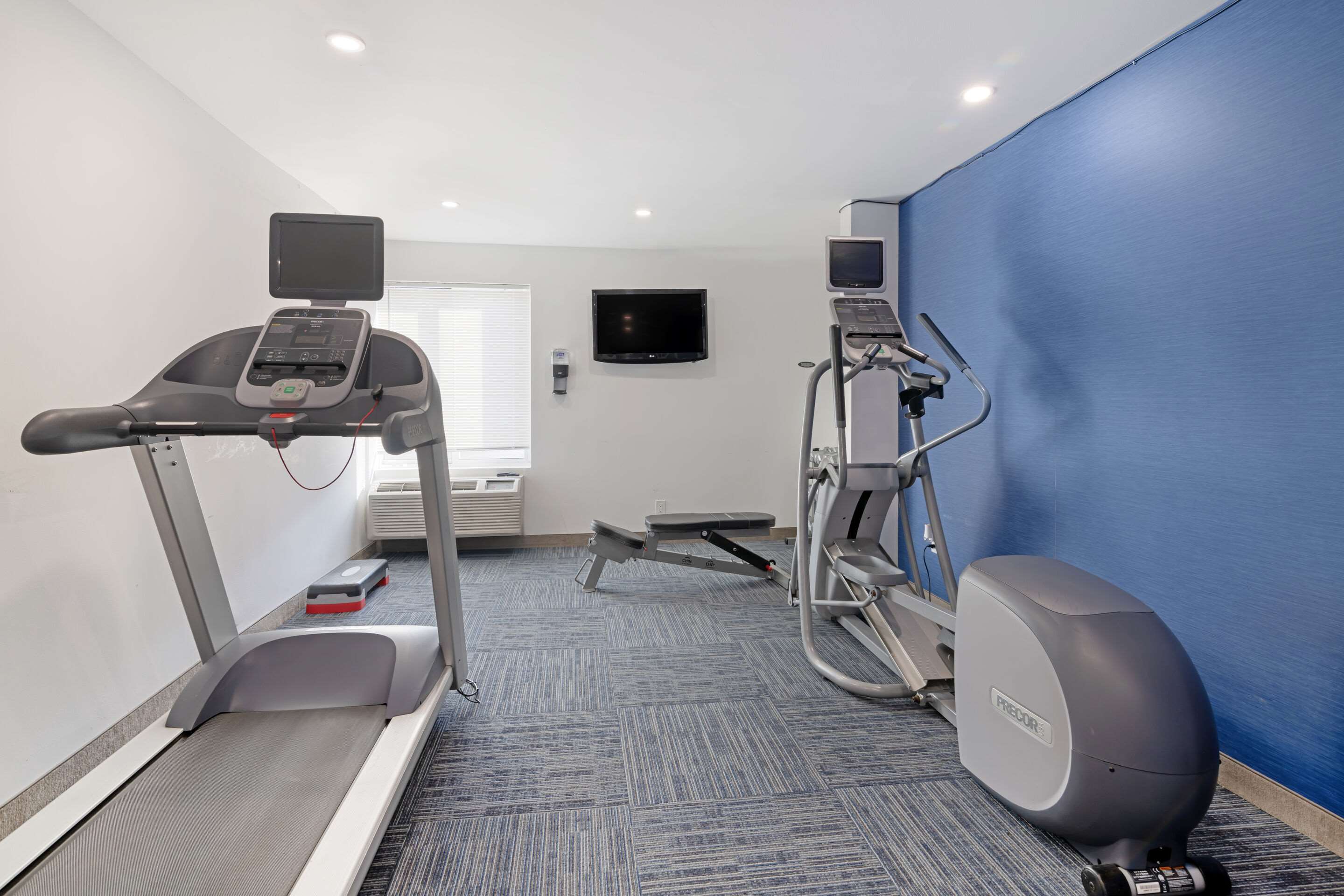 Exercise room with cardio equipment | Quality Inn