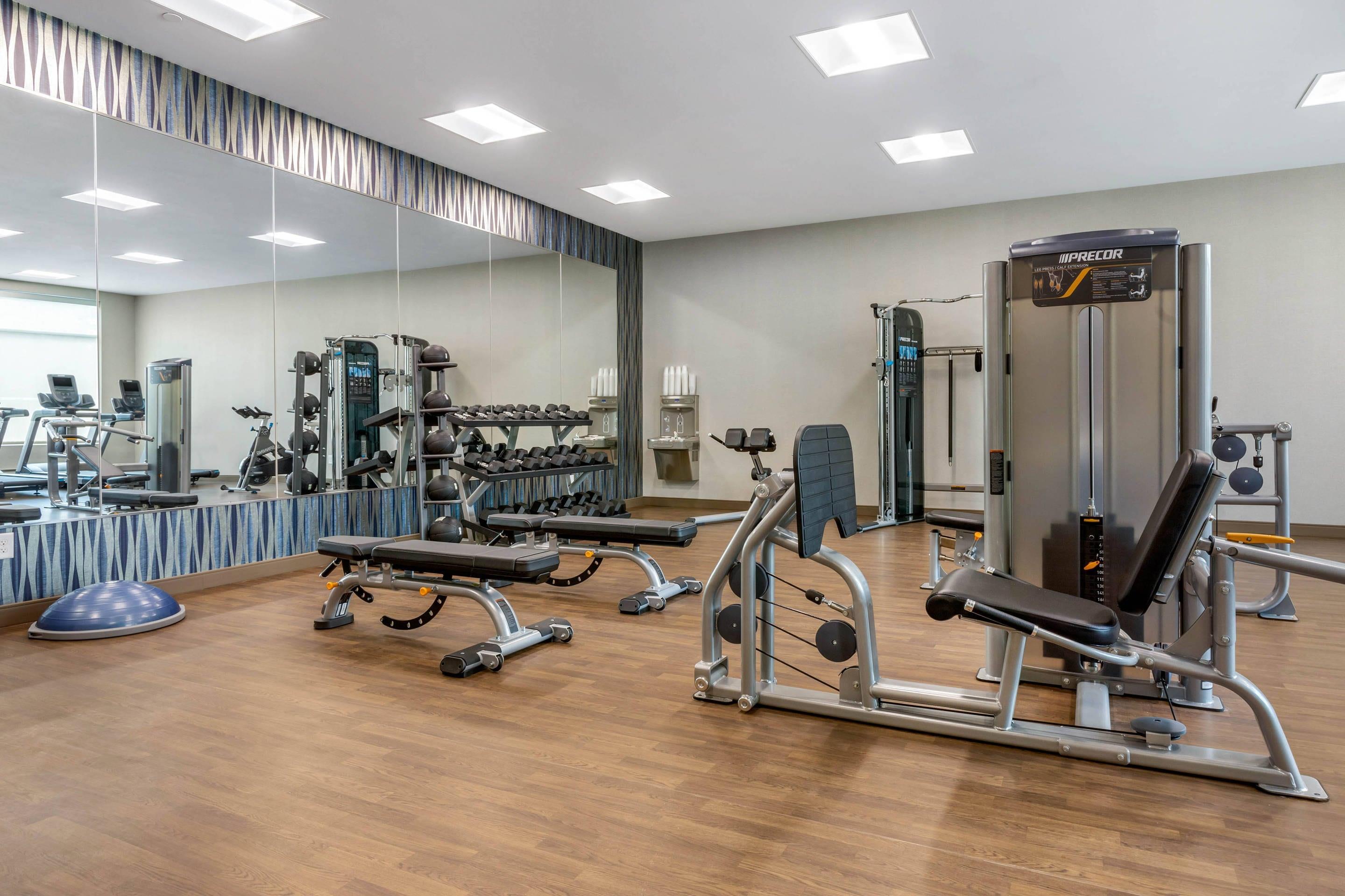 Exercise room with cardio equipment and weights | Cambria Hotel Fort Mill