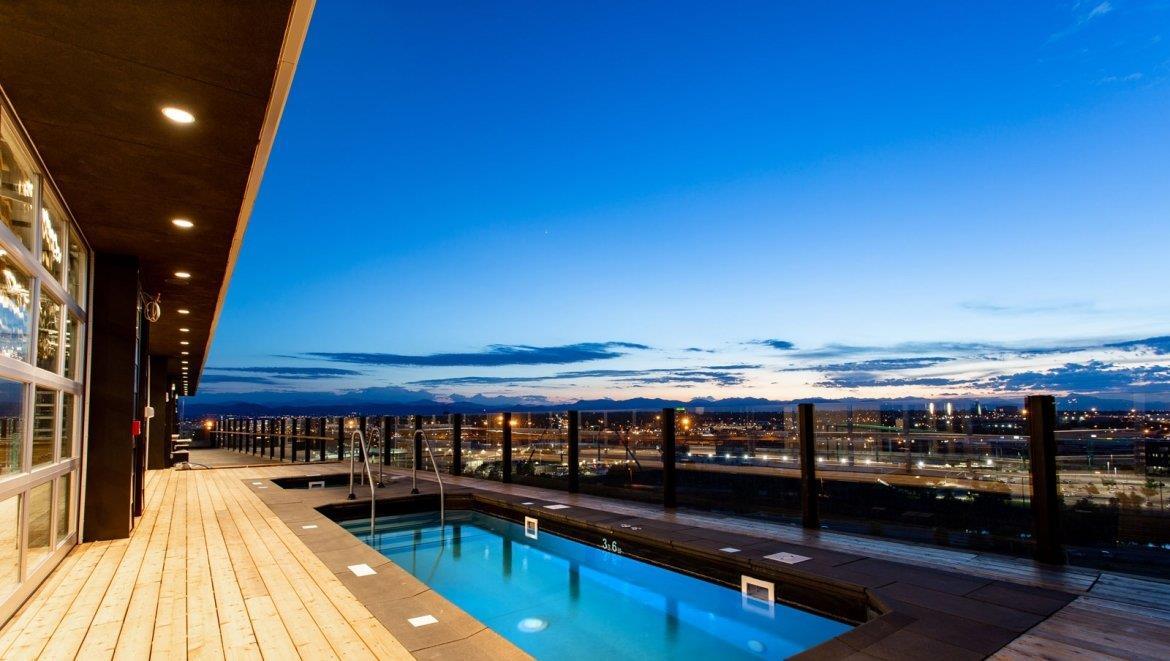 Nightime view from rooftop pool | The Source Hotel