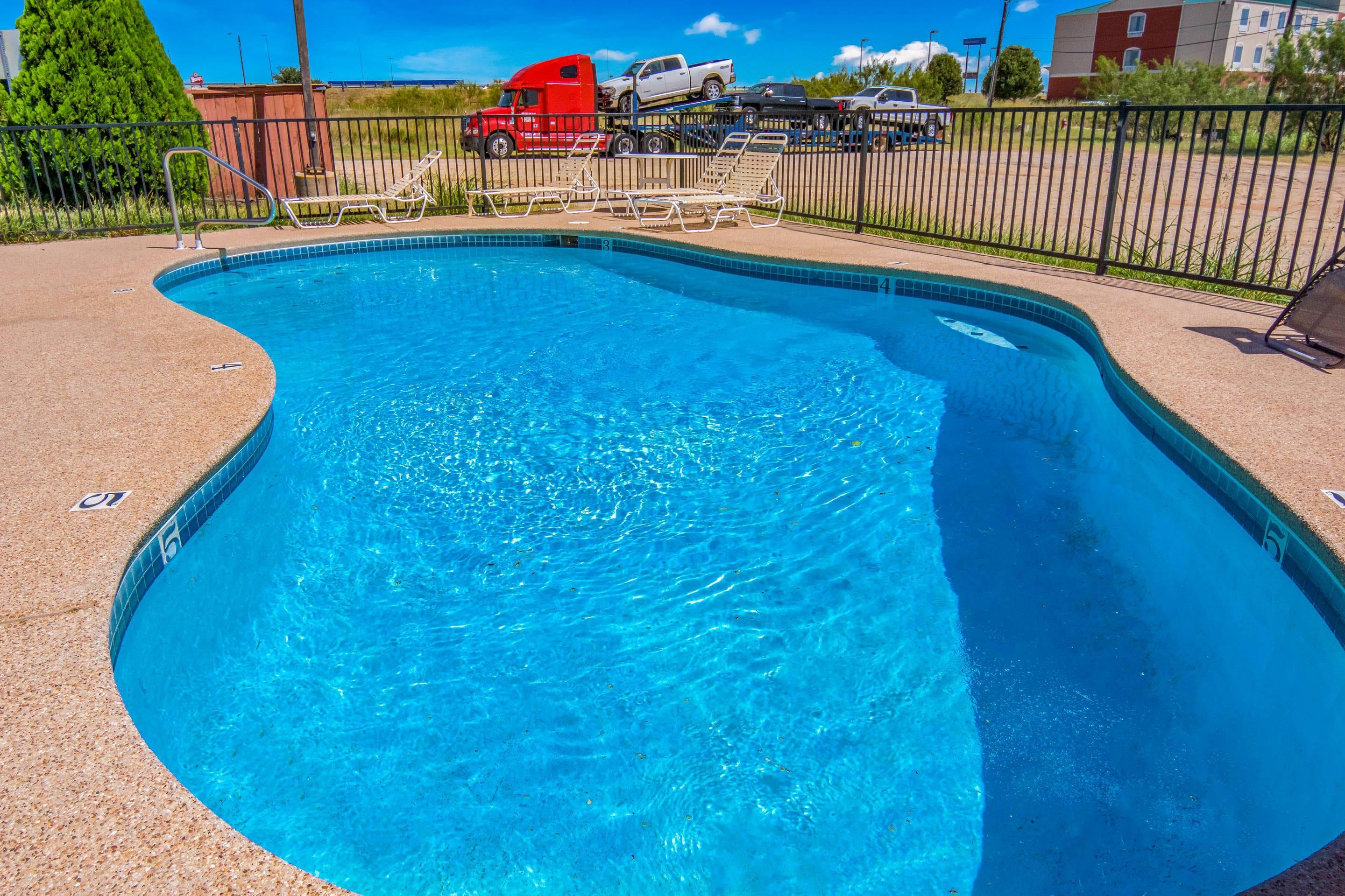 Outdoor pool | Econo Lodge Inn & Suites