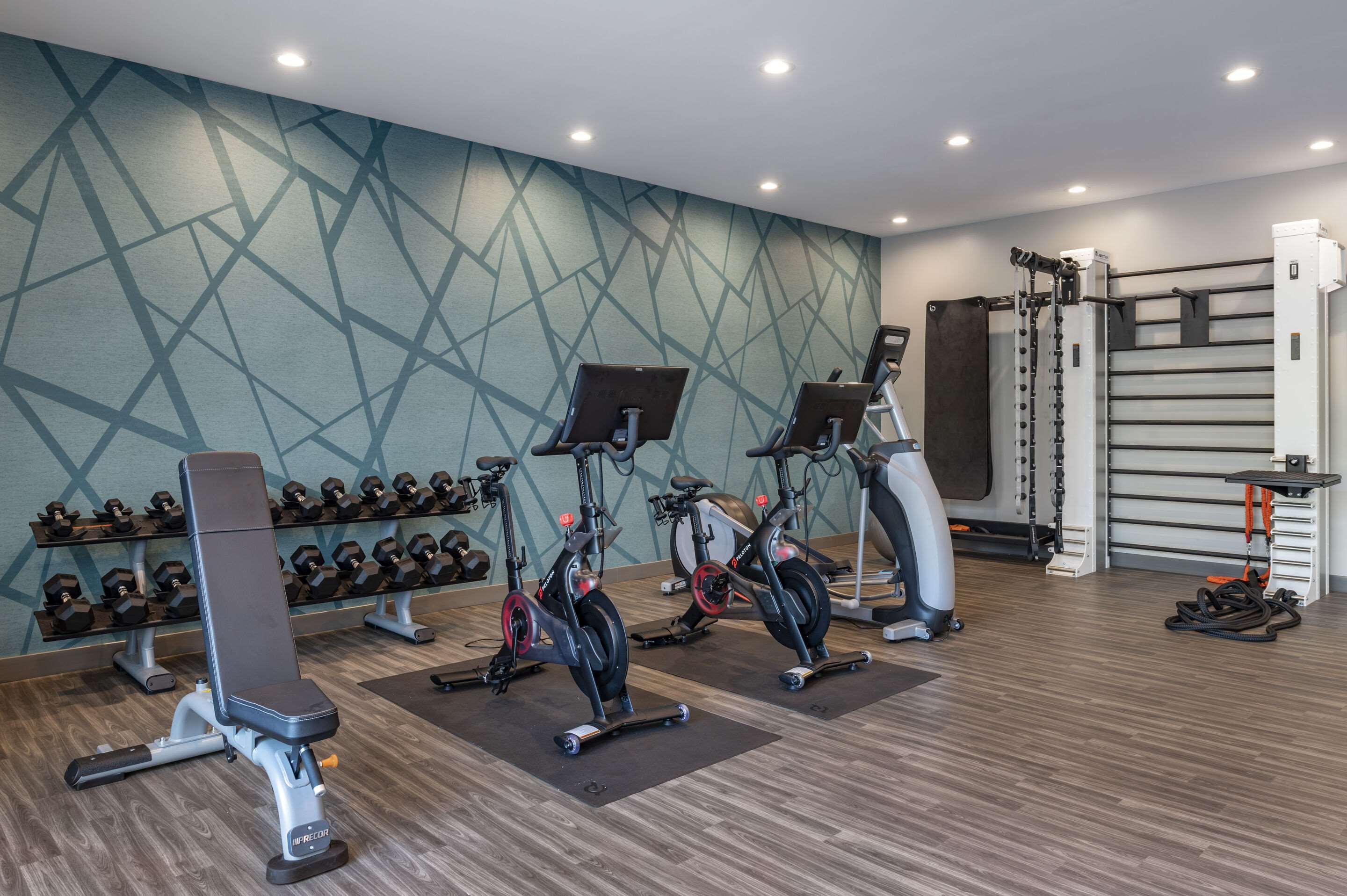 Exercise room with cardio equipment and weights | Cambria Hotel Nashville Airport