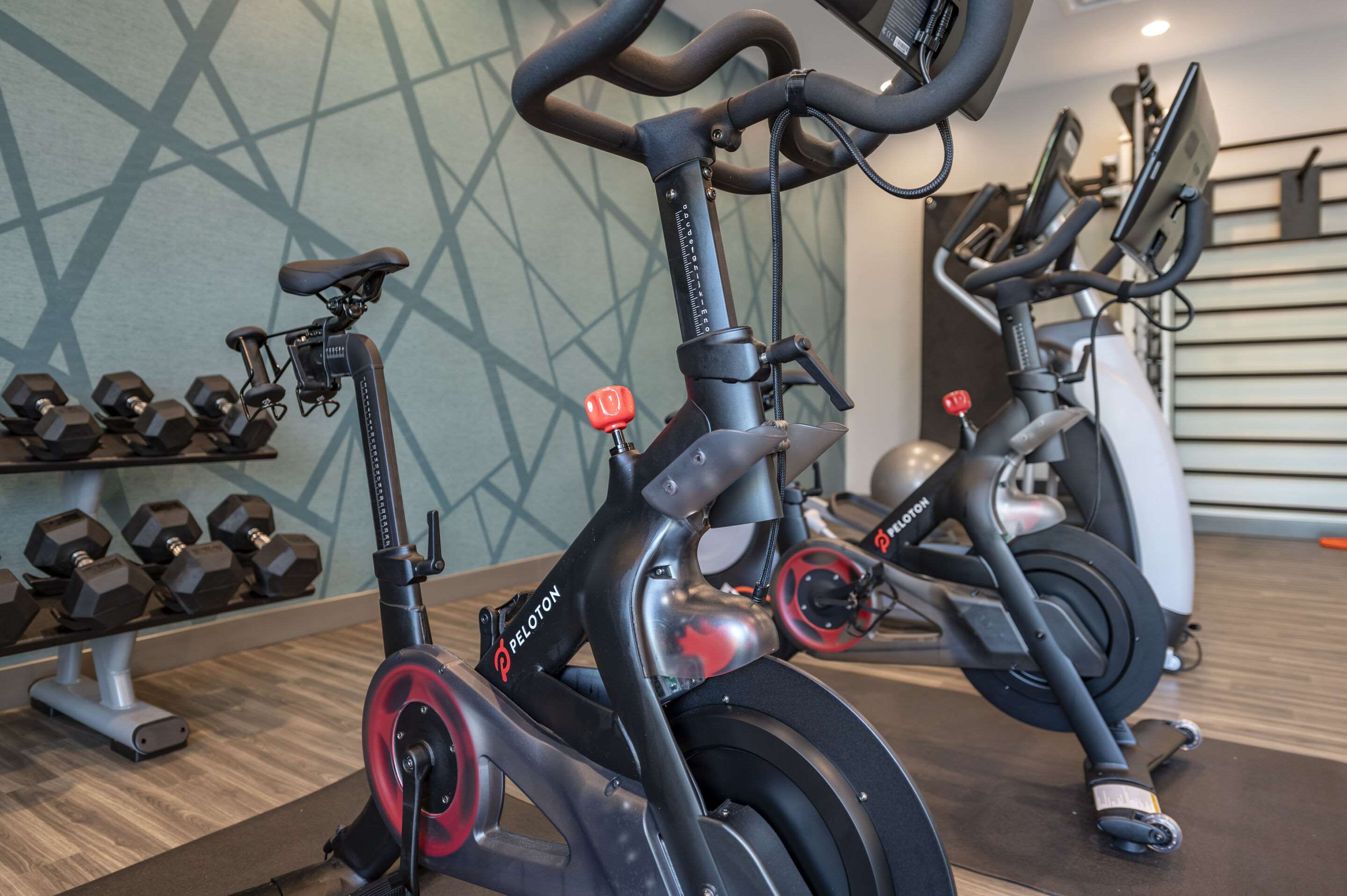 Exercise room with cardio equipment and weights | Cambria Hotel Nashville Airport