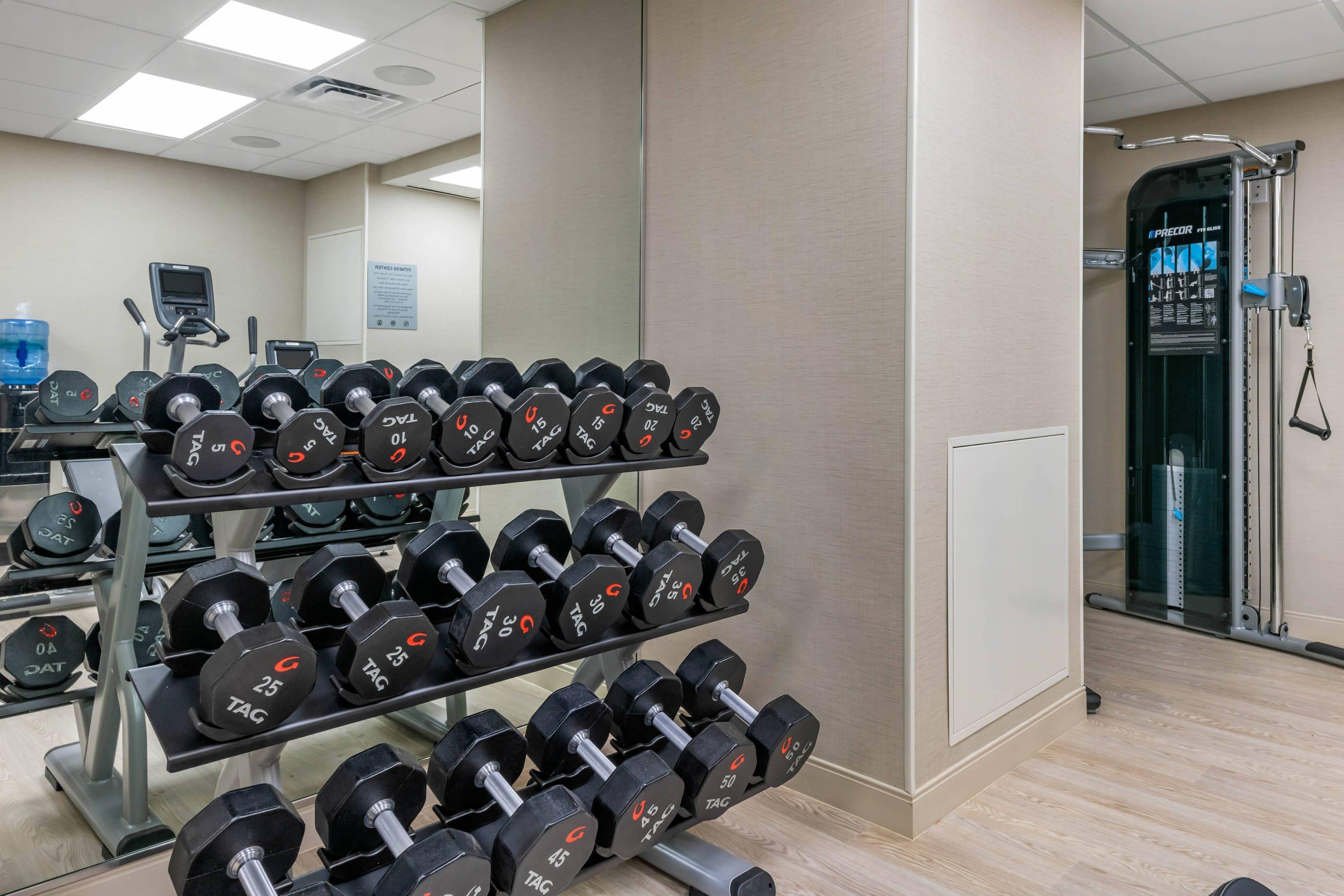 Exercise room with cardio equipment and weights | Cambria Hotel St Petersburg-Madeira Beach Marina