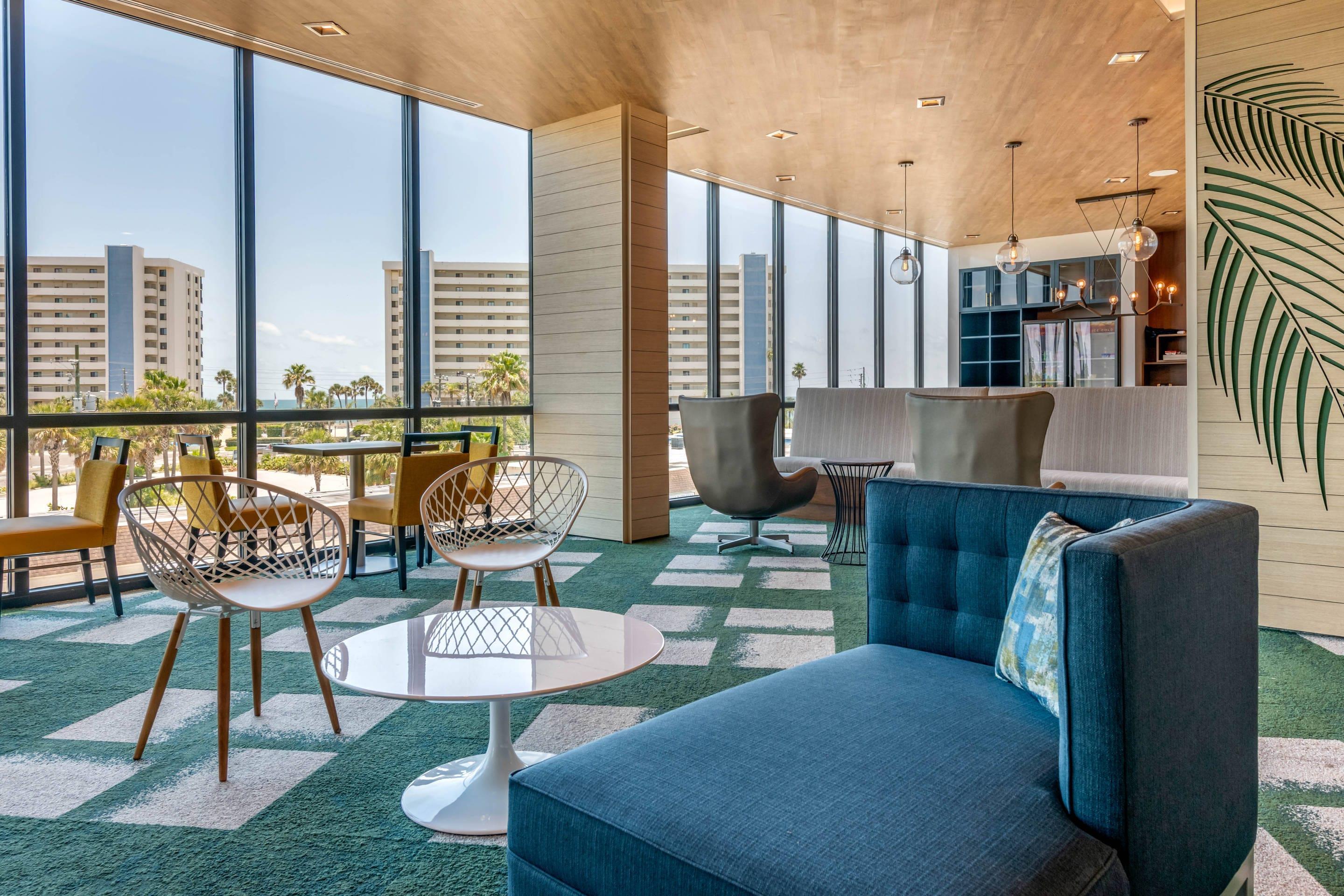 Spacious lobby with sitting area | Cambria Hotel St Petersburg-Madeira Beach Marina