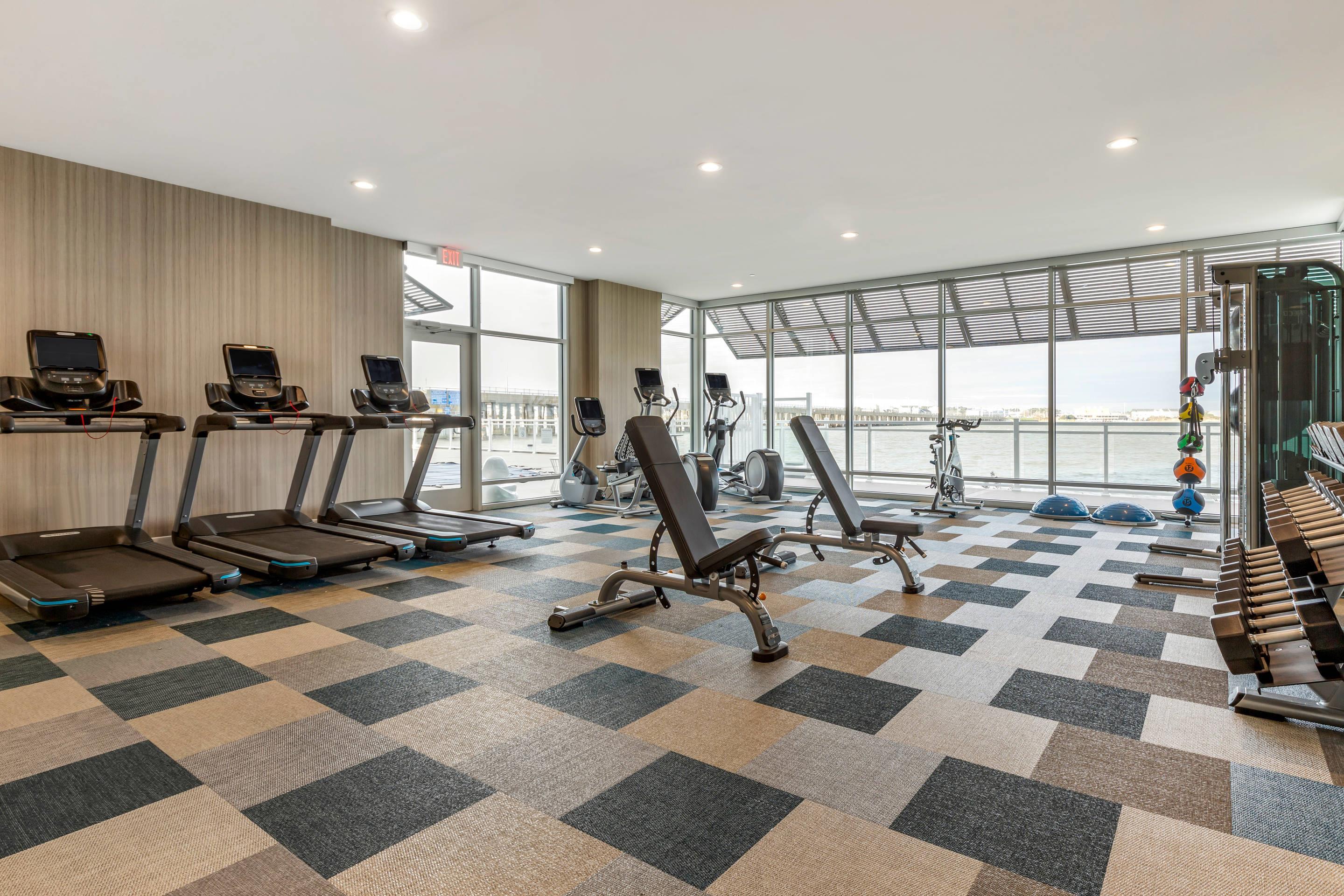 Exercise room with cardio equipment and weights