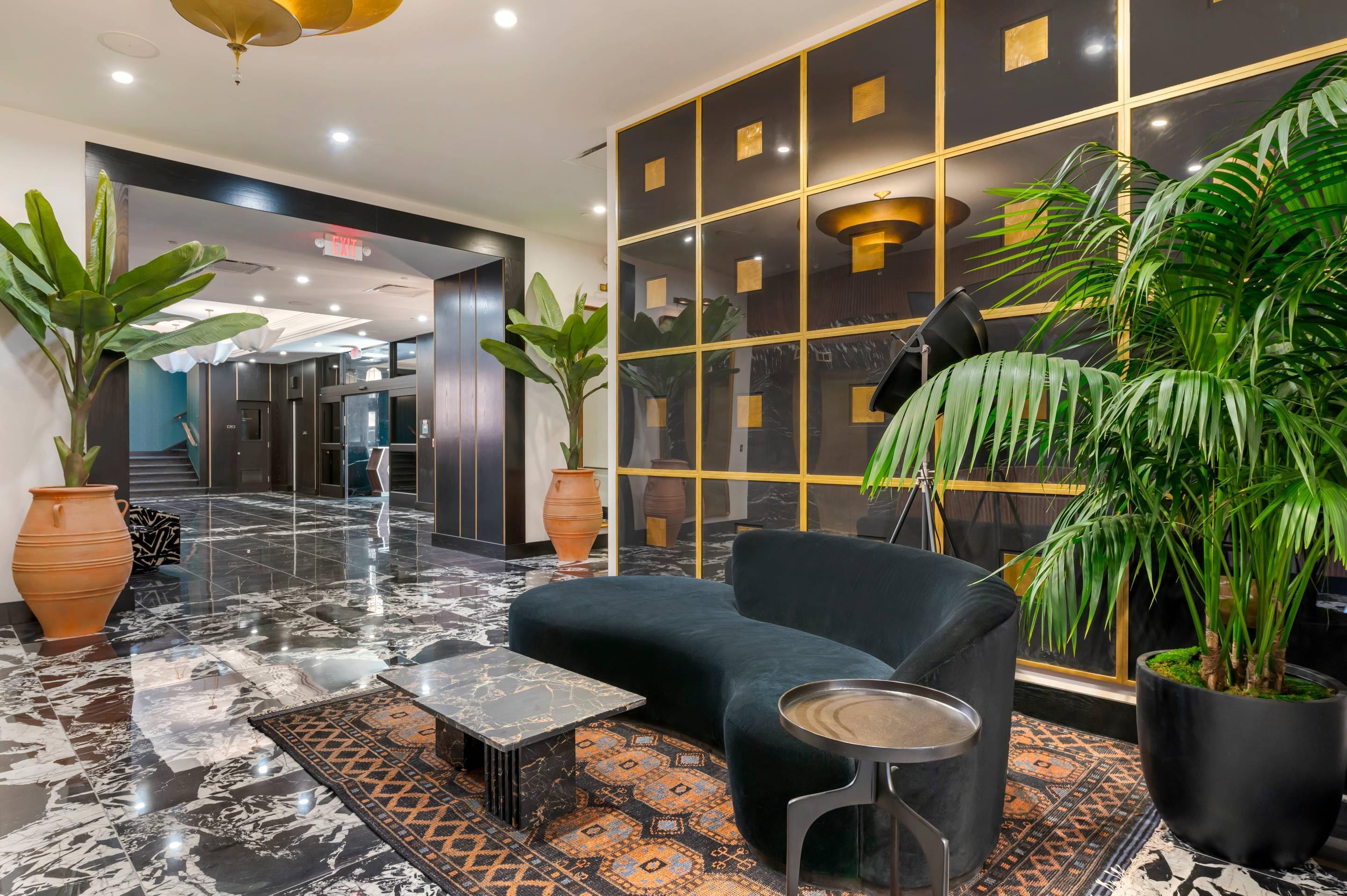 Lobby with sitting area | Cambria Hotel Detroit Downtown