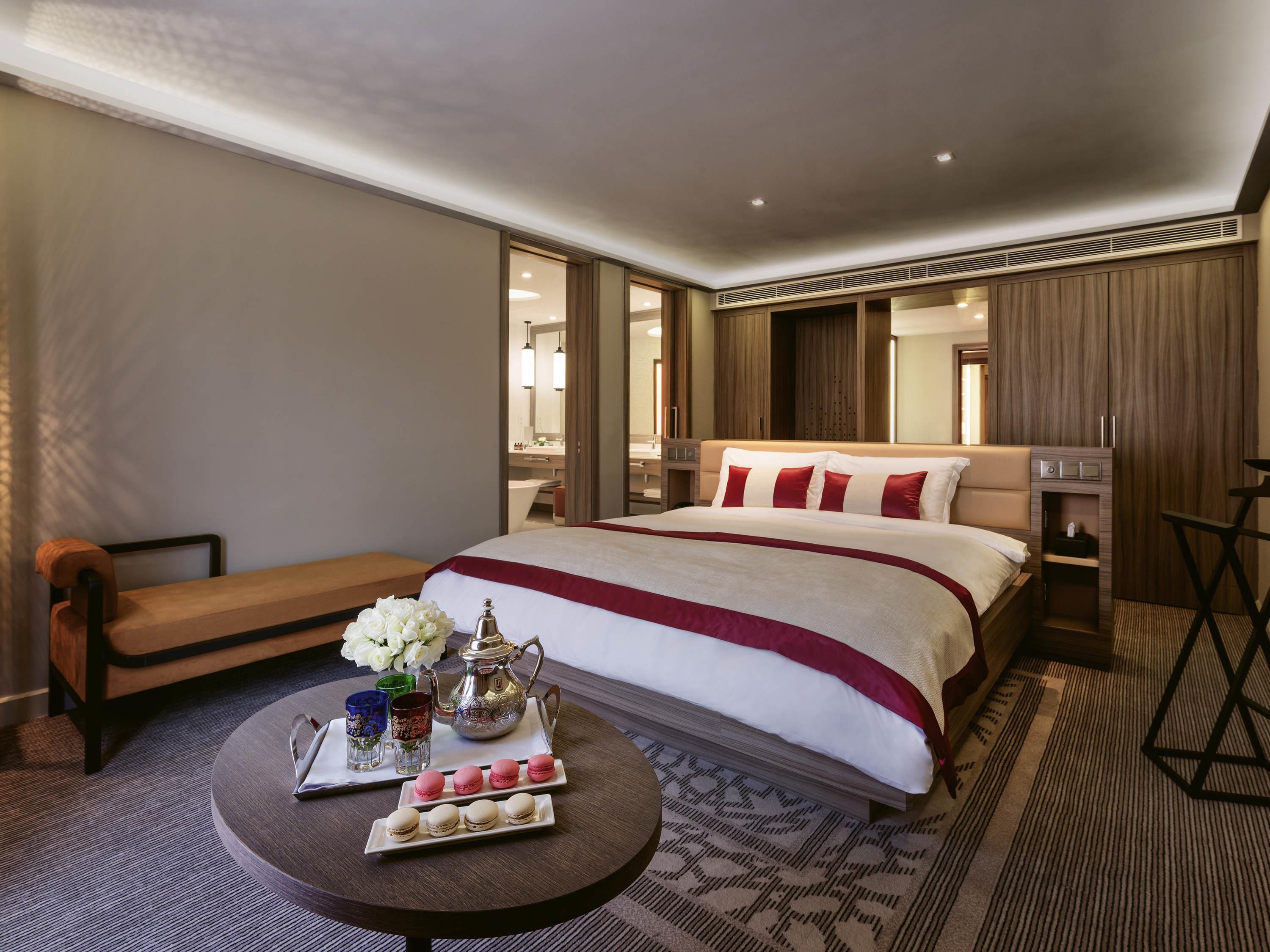 M Room Type - Family Suite, 2 bedrooms, 1 King-size and 2 single beds, and a private living room with sofa
