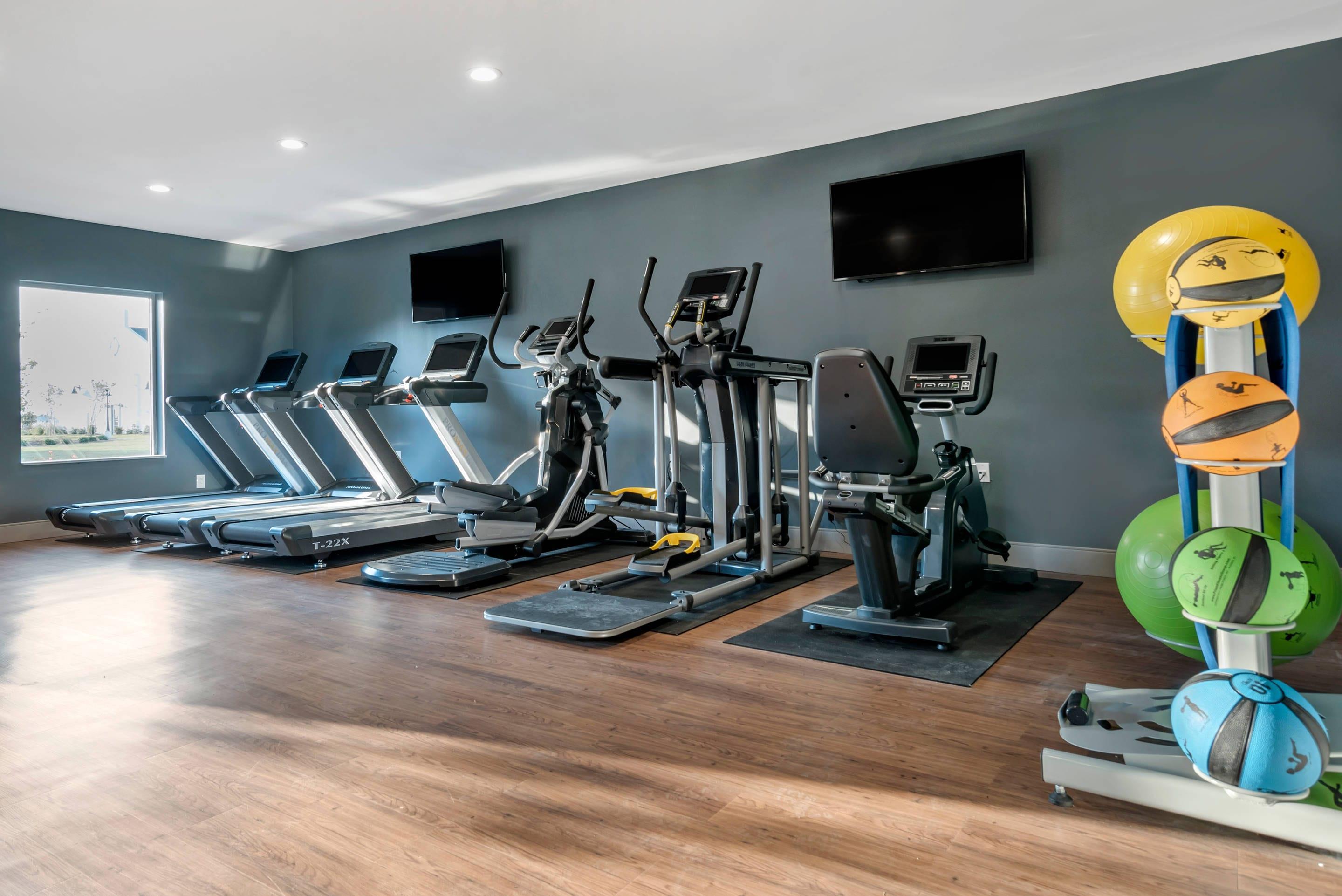Fitness center with television | Lyric Hotel West End, Ascend Hotel Collection