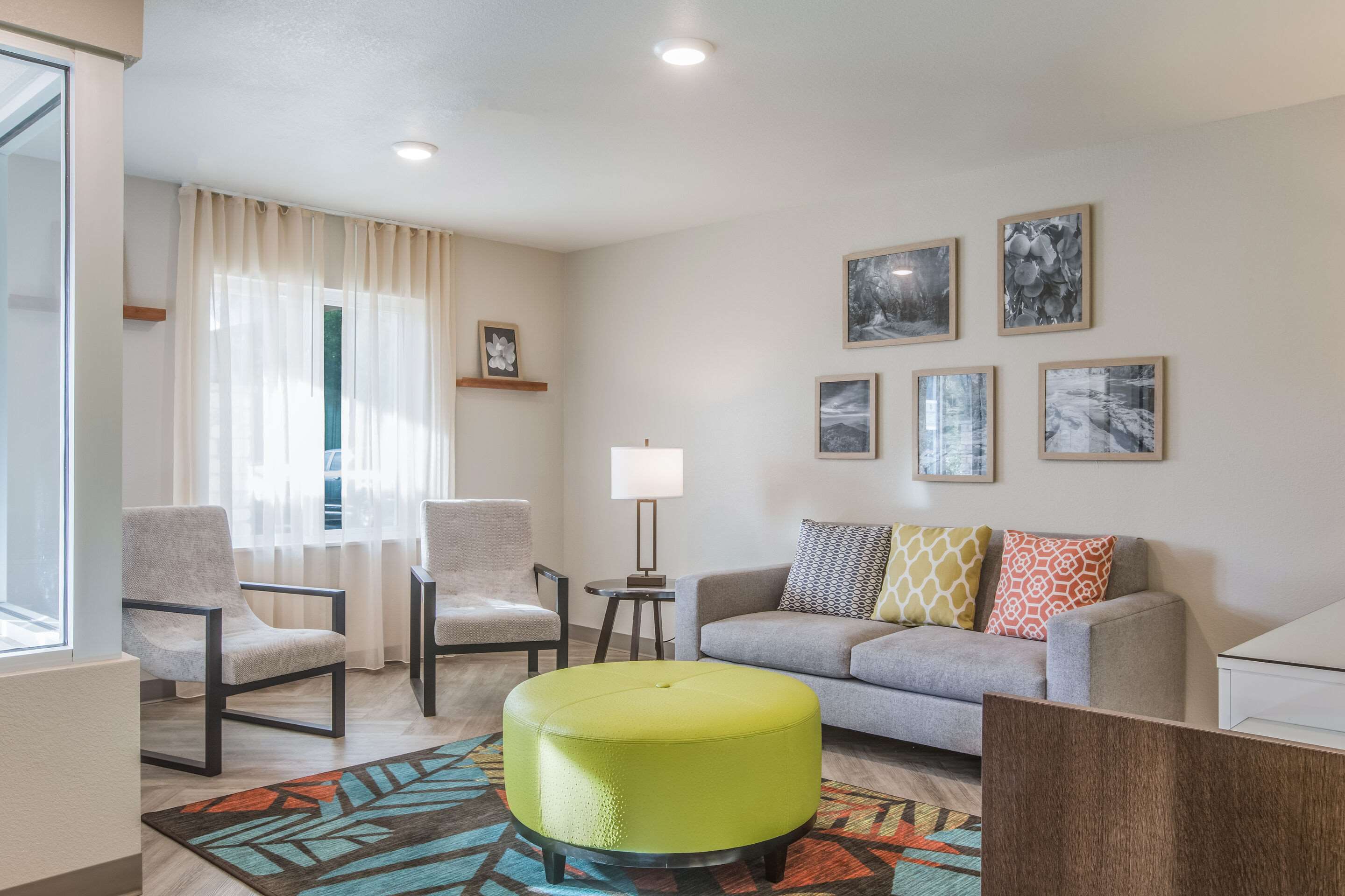 Lobby with sitting area | WoodSpring Suites Atlanta McDonough