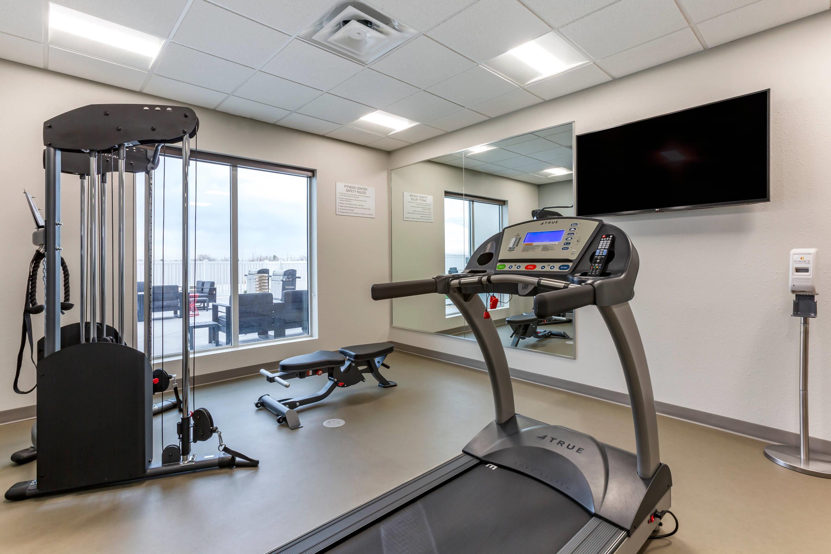 Fitness center with television | MainStay Suites