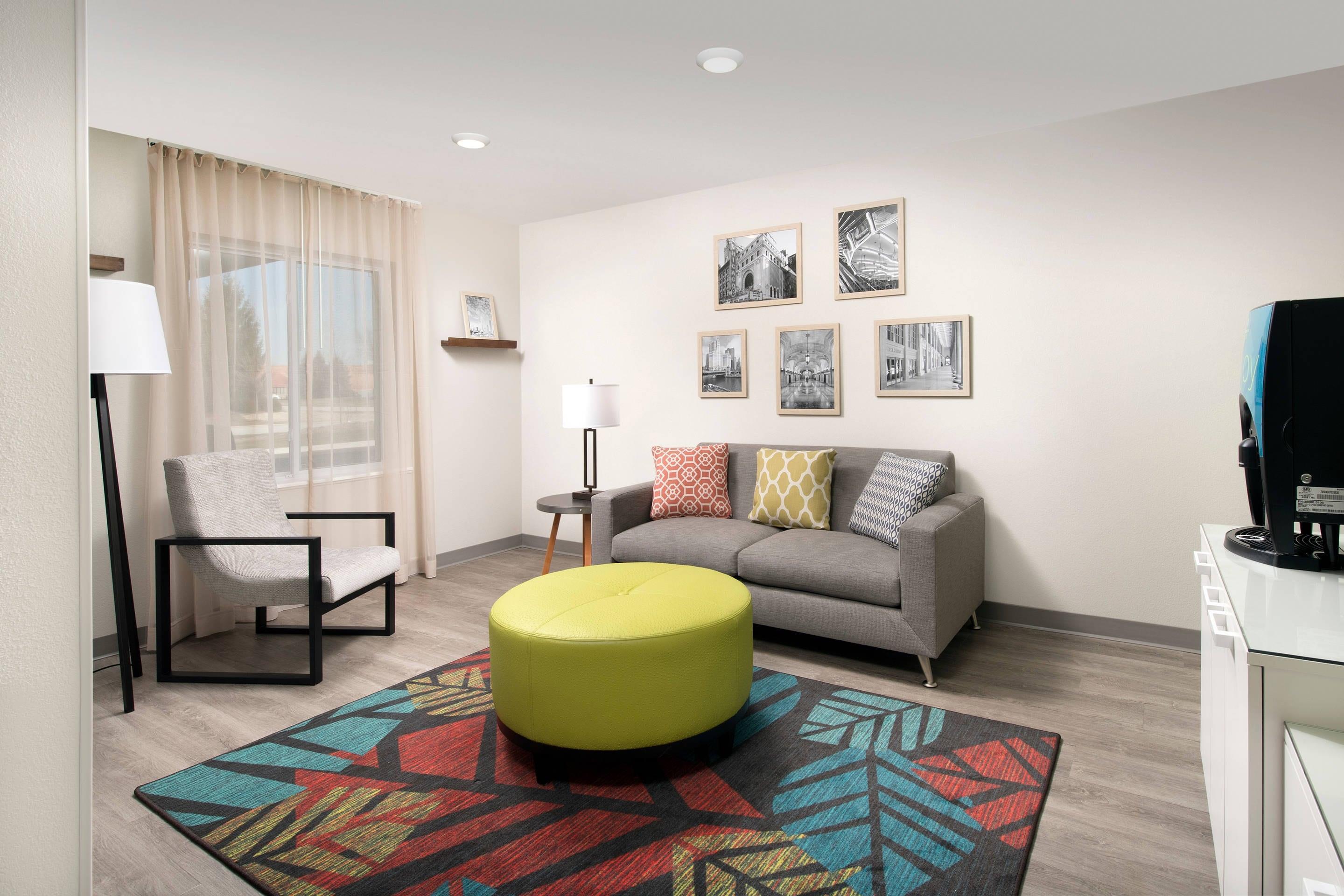 Lobby with sitting area | WoodSpring Suites Orlando International Drive