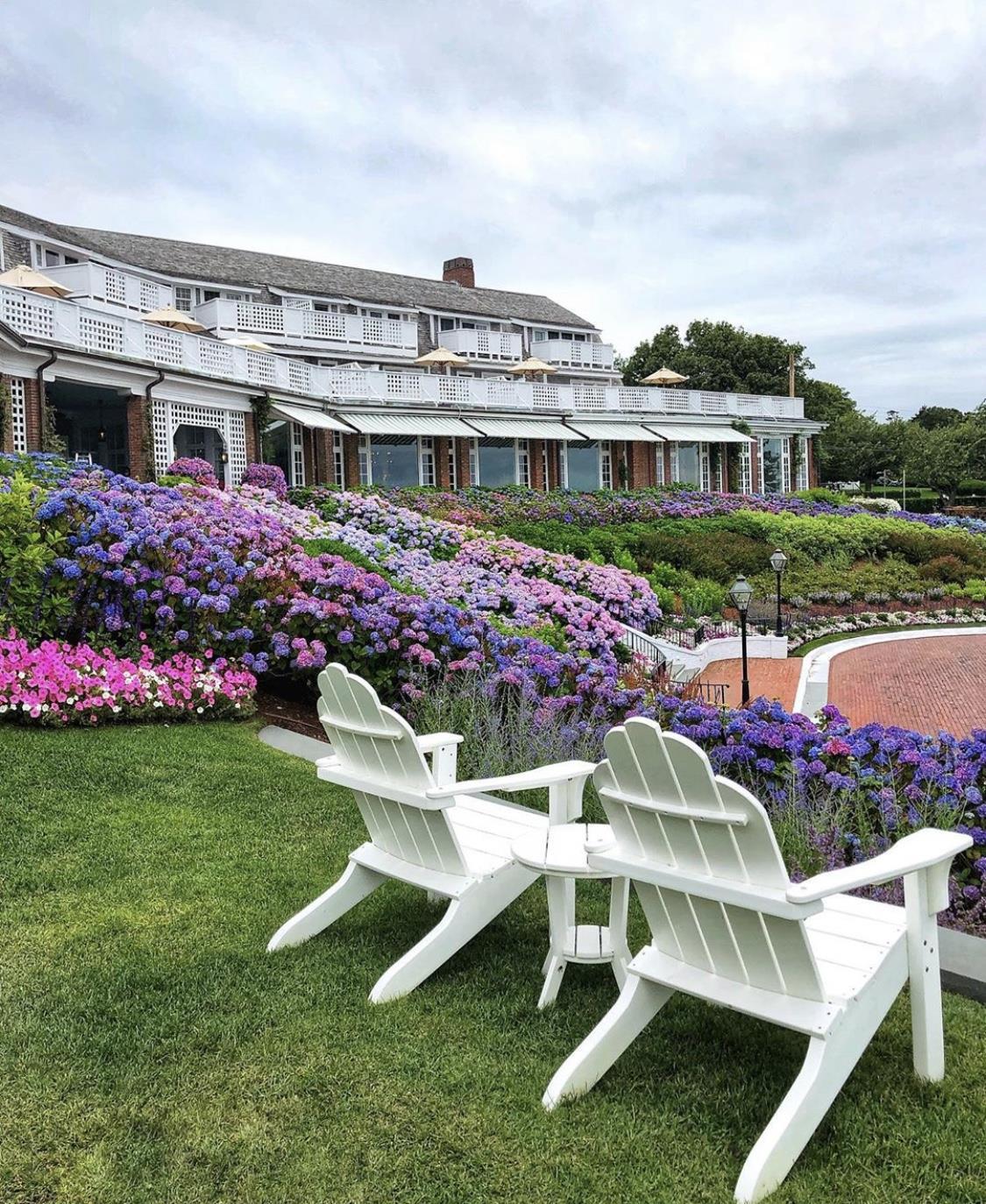 Front of Inn with hydrangeas and Adirondacks | Chatham Bars Inn
