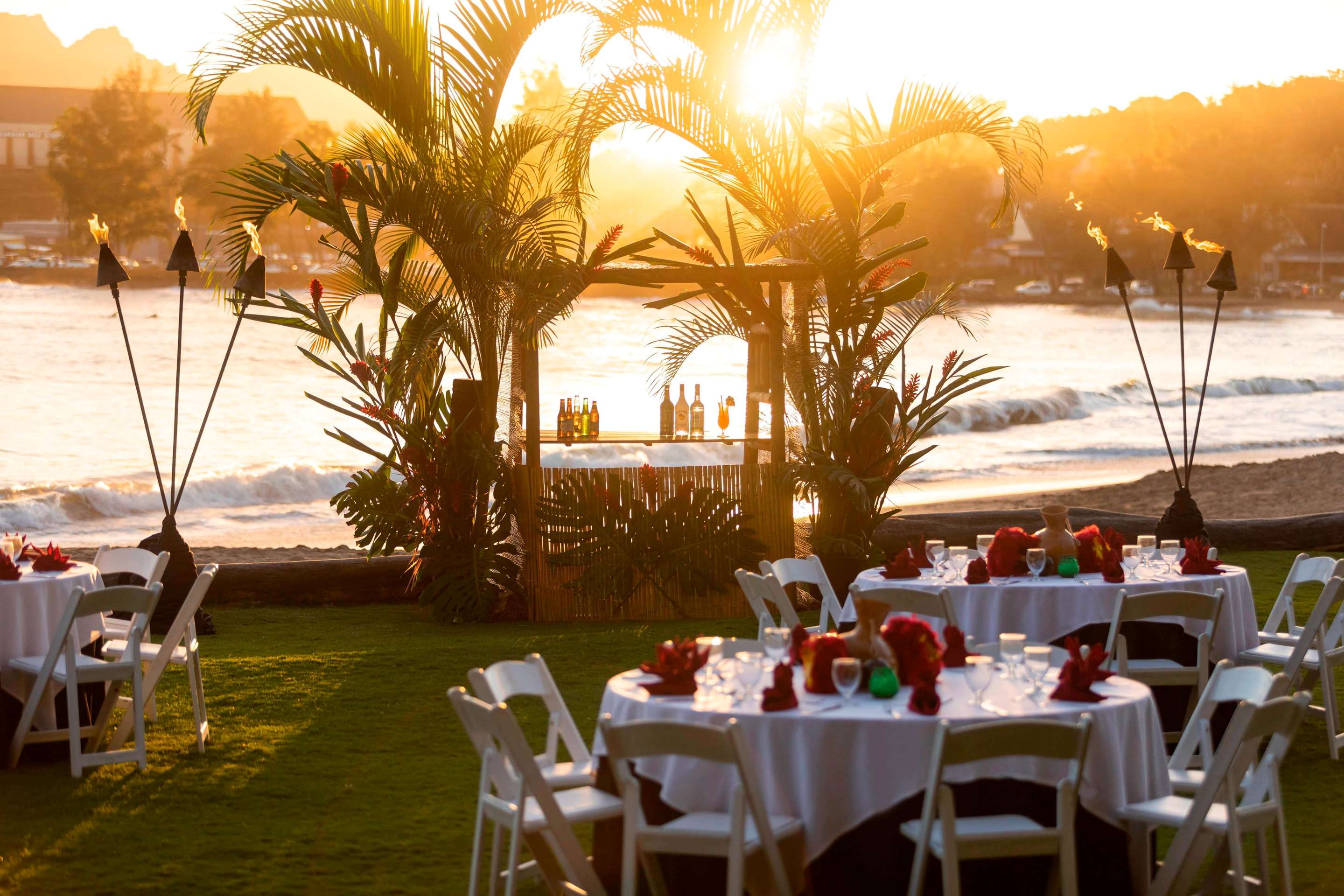 Beachfront lawn sunset luau