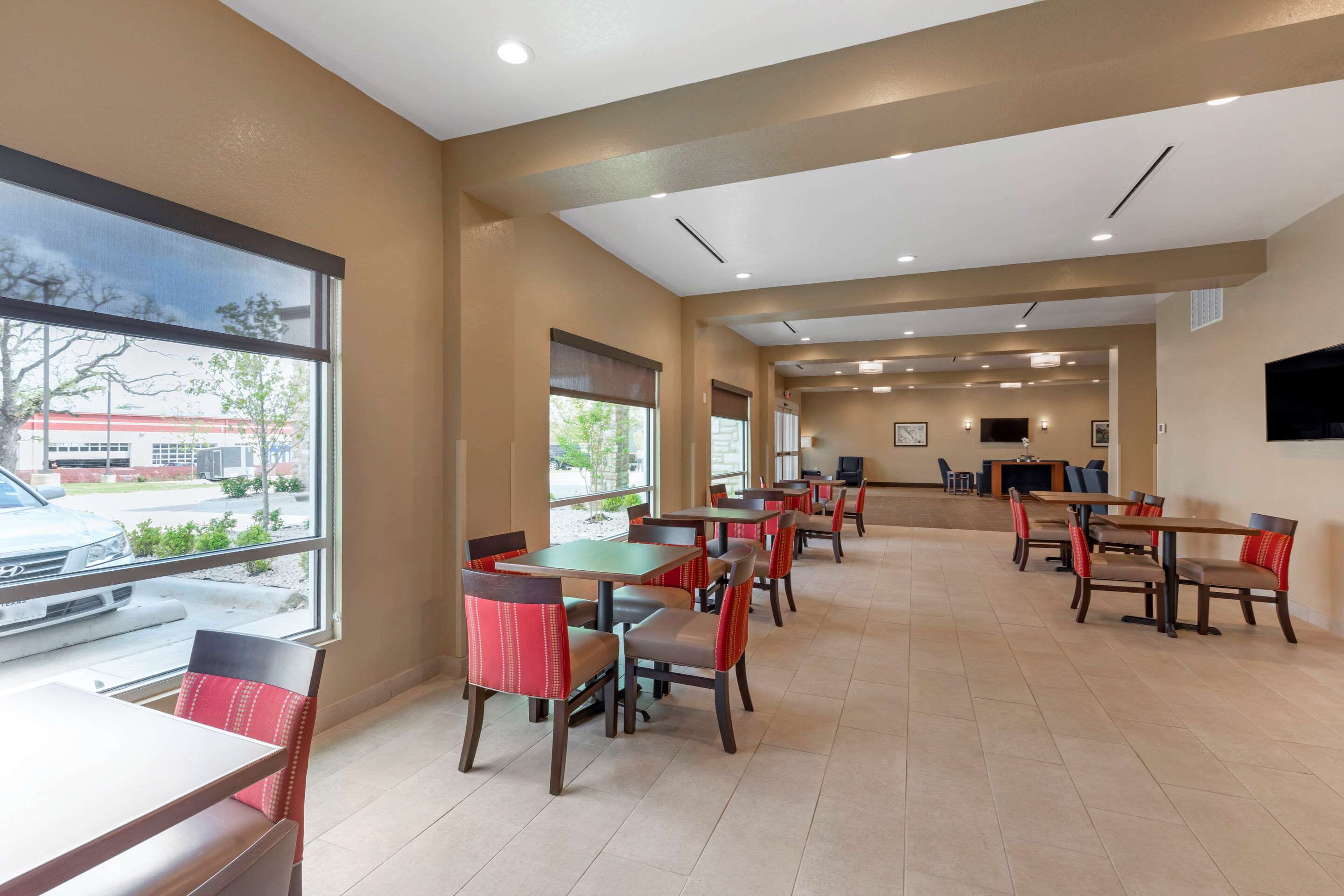 Enjoy breakfast in this seating area | Comfort Inn & Suites Euless DFW West