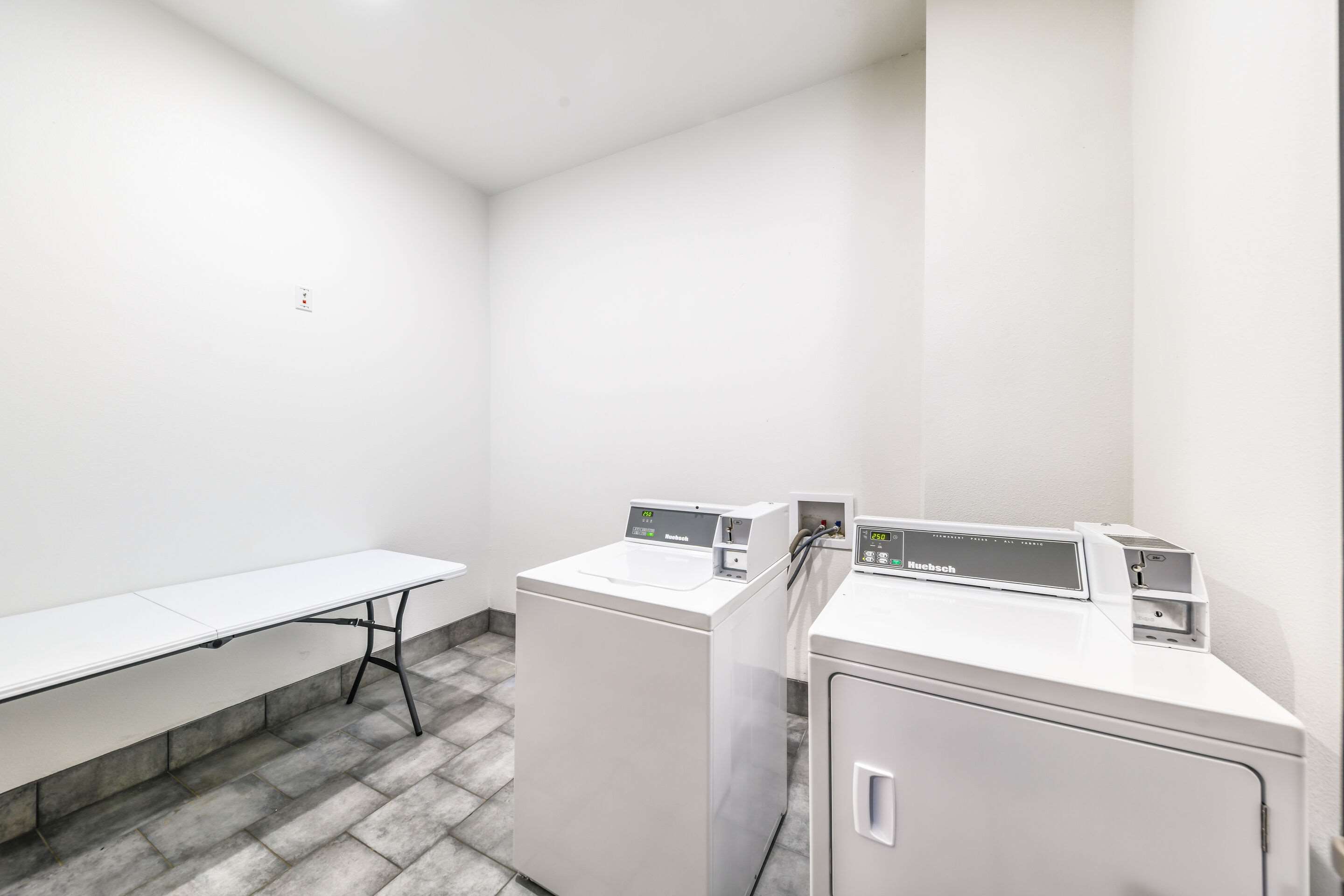 Guest laundry facilities | Hy-Lo Hotel, Ascend Hotel Collection