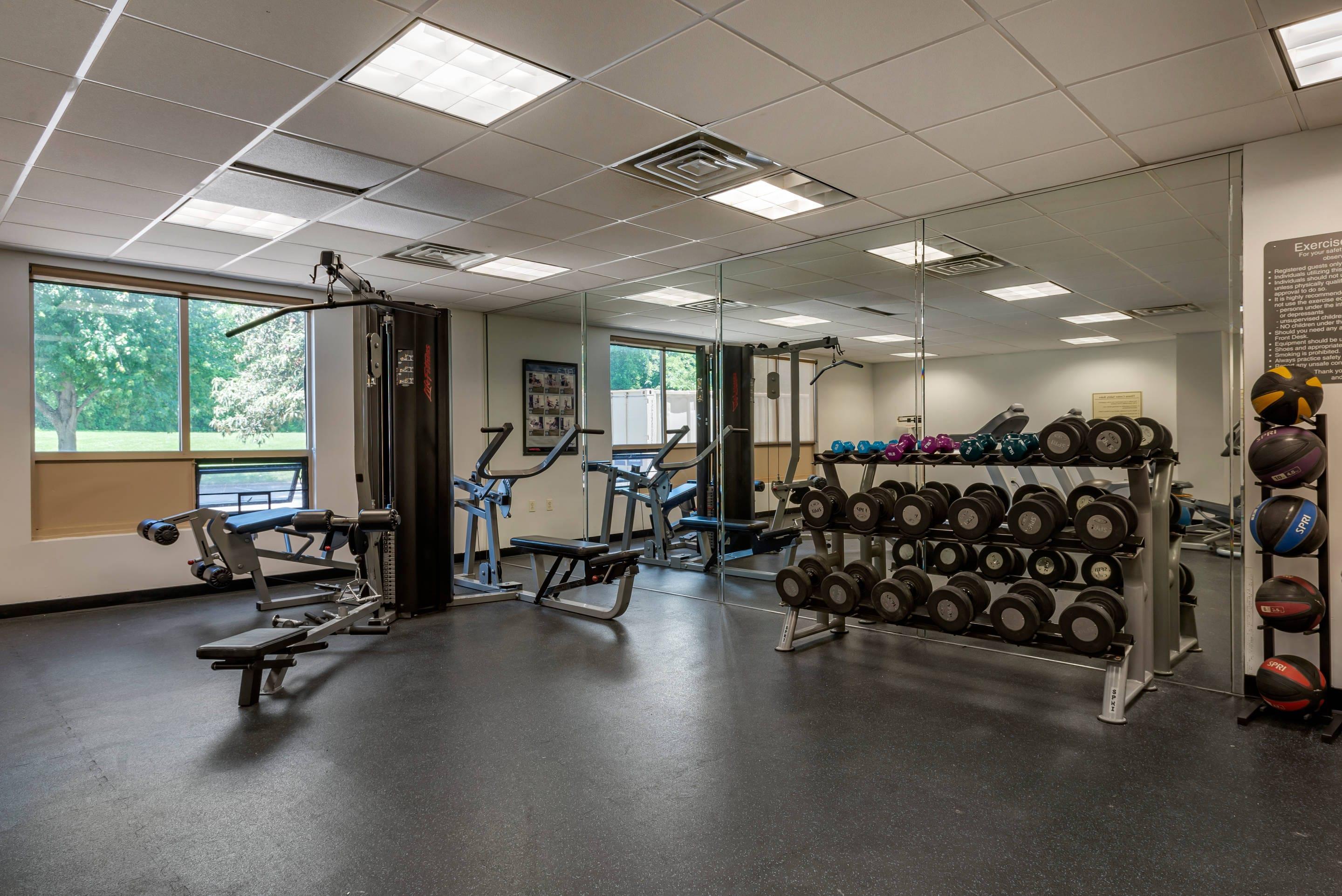 Exercise room with cardio equipment and weights | Comfort Inn Horsham - Philadelphia