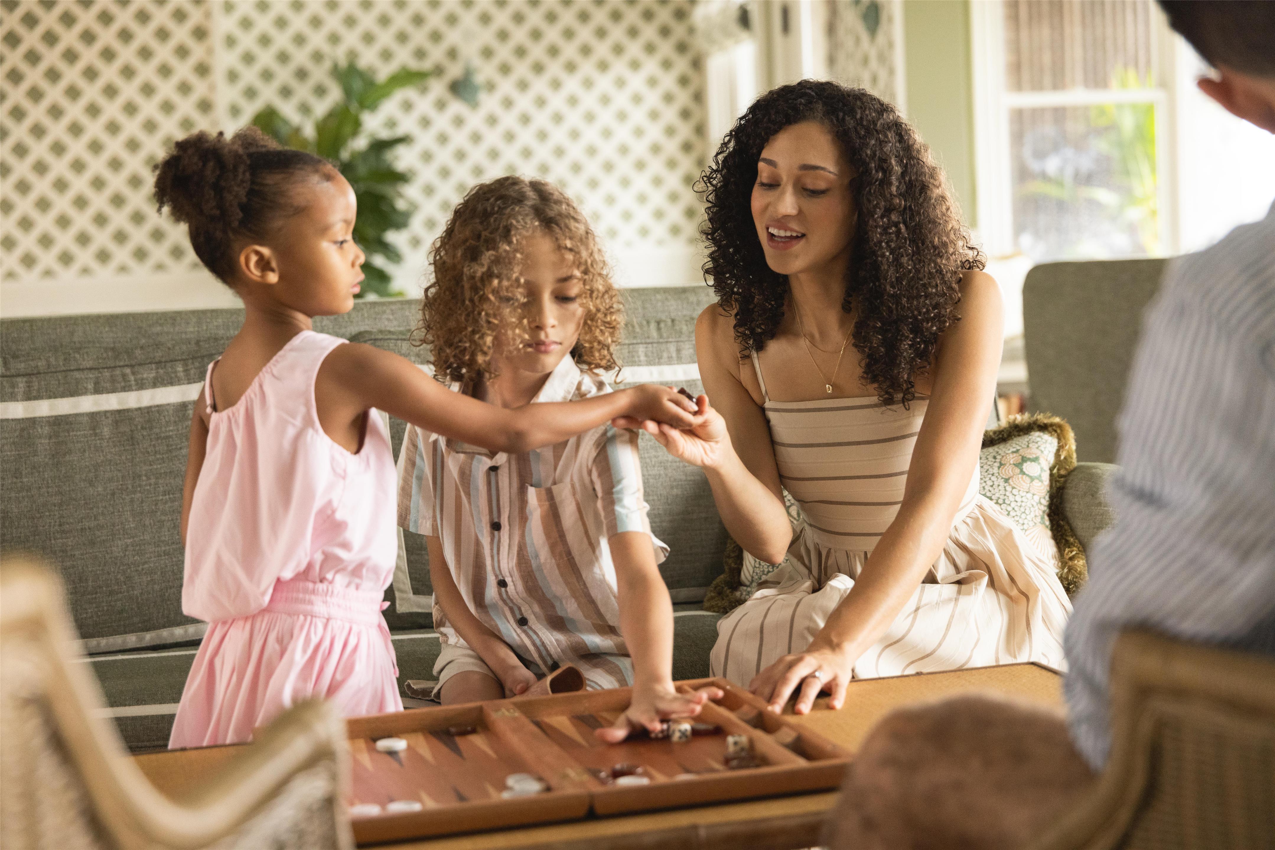 Family playing games in the Beach House Loft | Sanderling Resort Residences