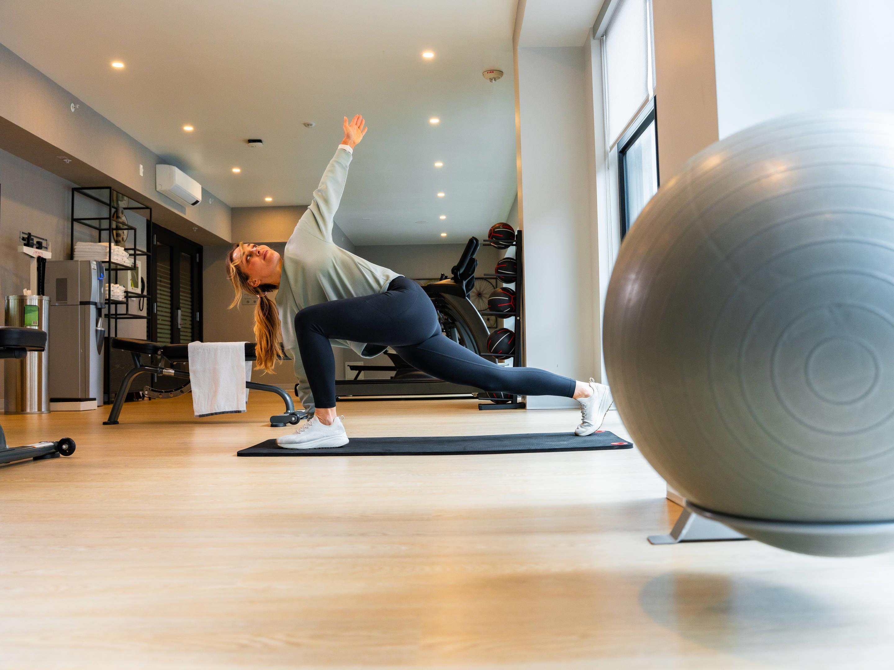 Exercise room with cardio equipment and weights