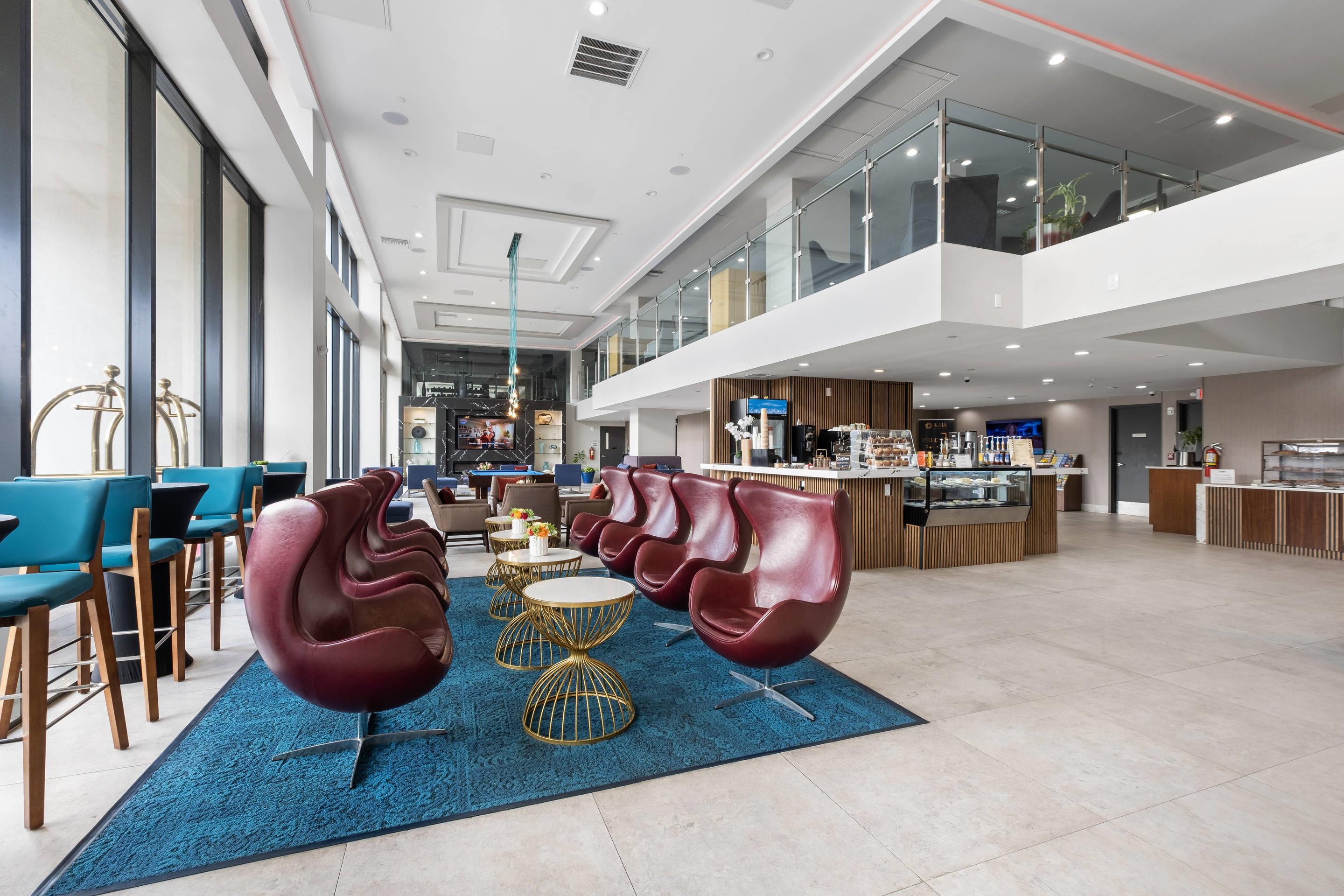 Spacious lobby with sitting area | Cambria Hotel Orlando Universal Blvd