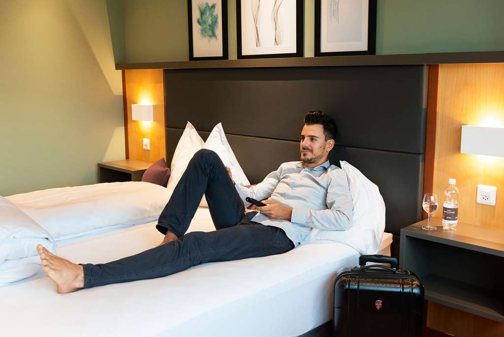 HOTEL CONFERENCE SEMPACHERSEE-guestroom-Guest Room,Bed,Bedding,Living Area,On-Site.jpg