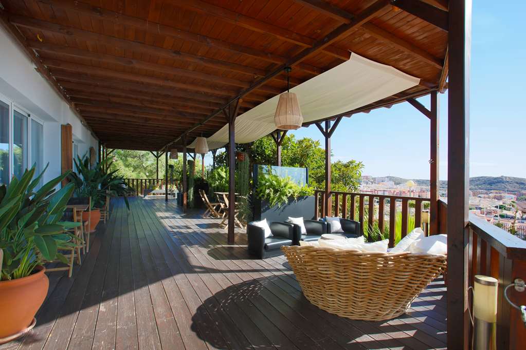 RAMADA RESORT BY WYNDHAM PUERTO DE-guestroom-Sitting area,On-Site.jpg