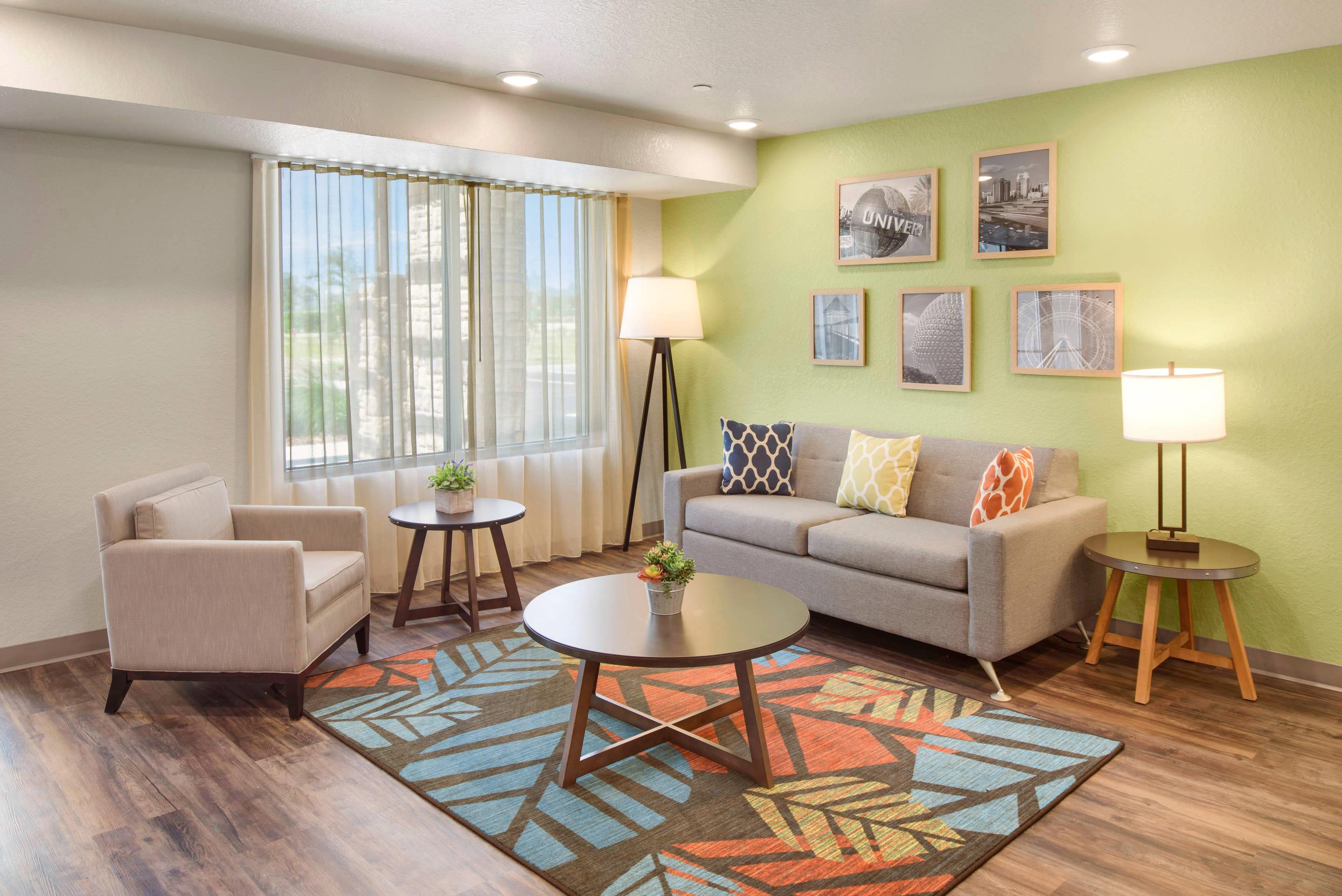 Lobby with sitting area | WoodSpring Suites Orlando I-4 & Convention Center