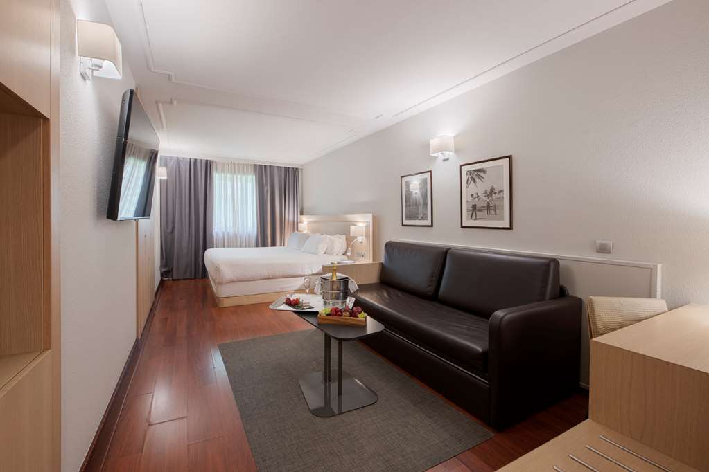 SUITES PLAZA HOTEL AND WELLNES-guestroom-Guest Room,On-Site.jpg