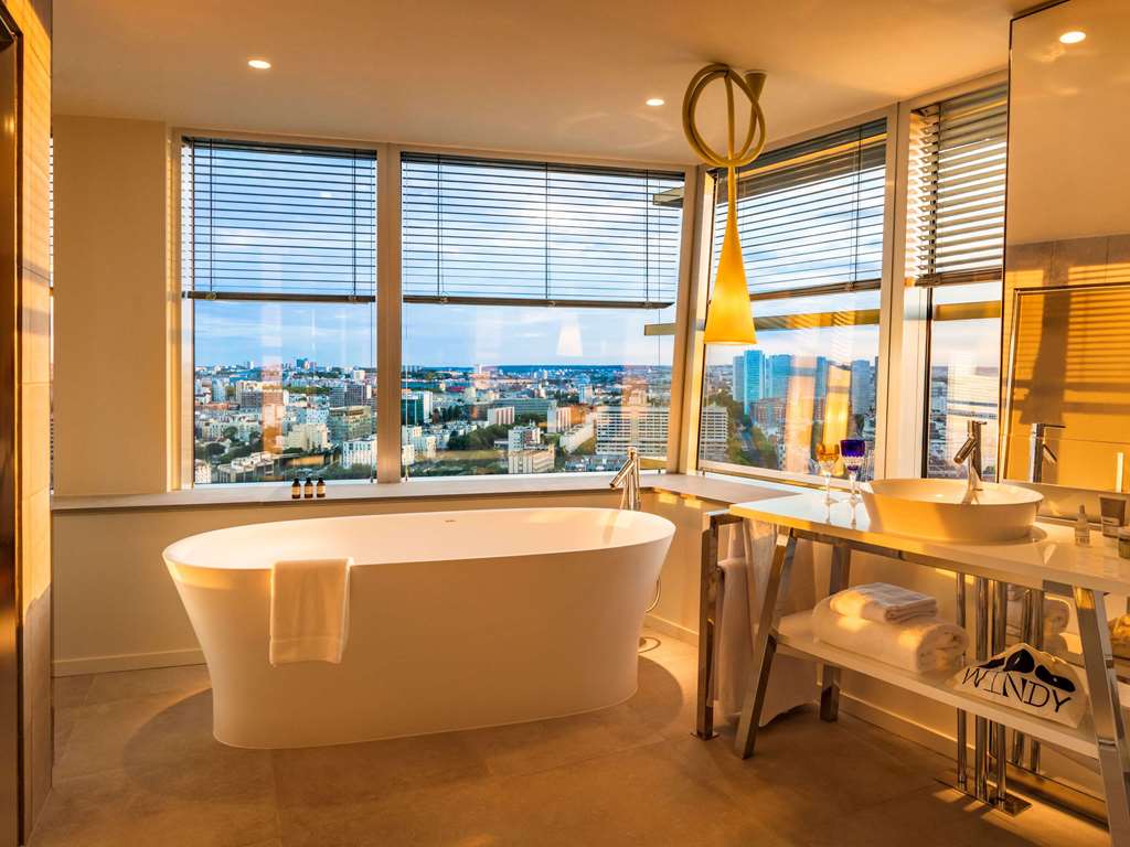 Too Hotel Paris - MGallery Room Type - EIFFEL TOWER JUNIOR SUITE Bathrm with view of Paris at sunset 1 king bed