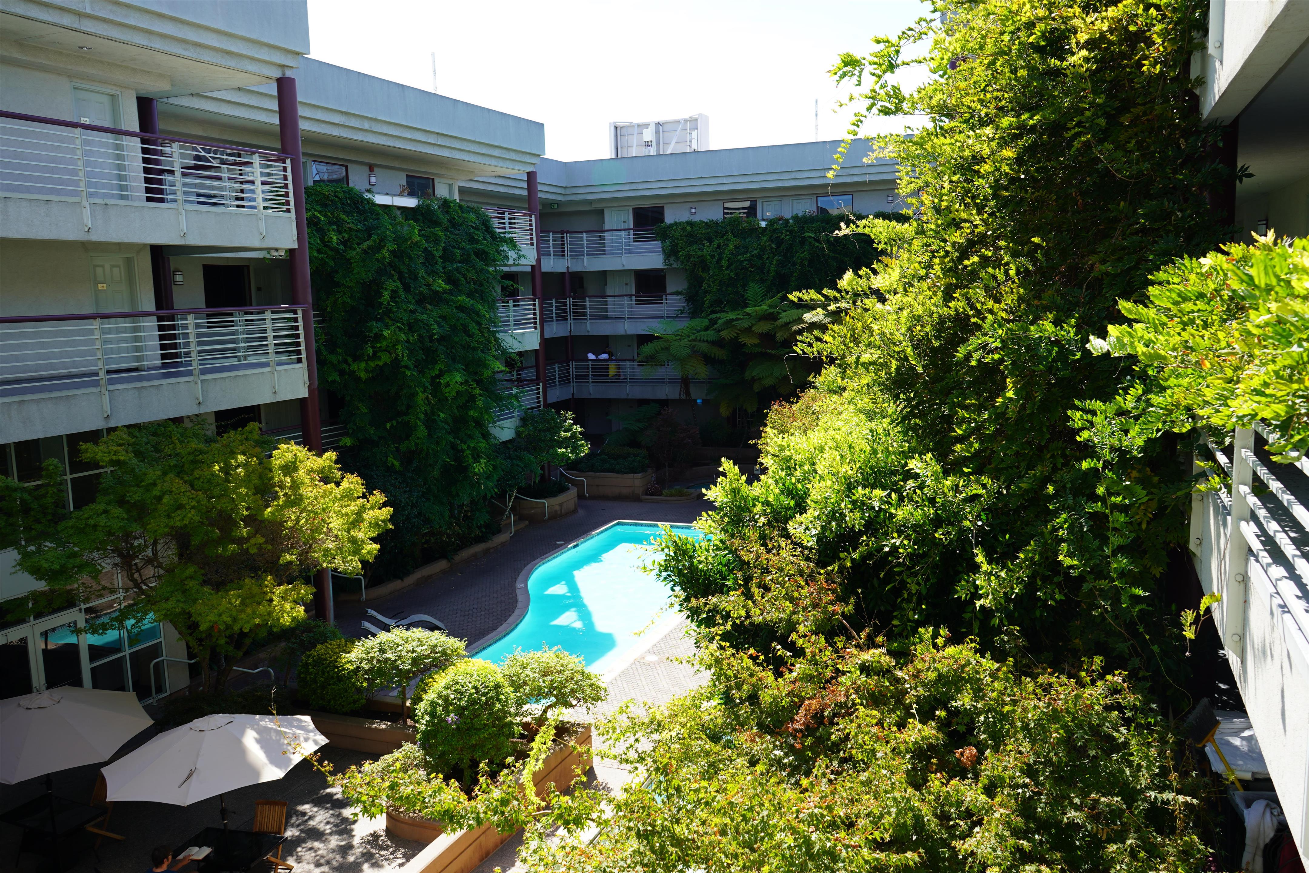 Outdoor Pool and Garden Area | Cupertino Hotel