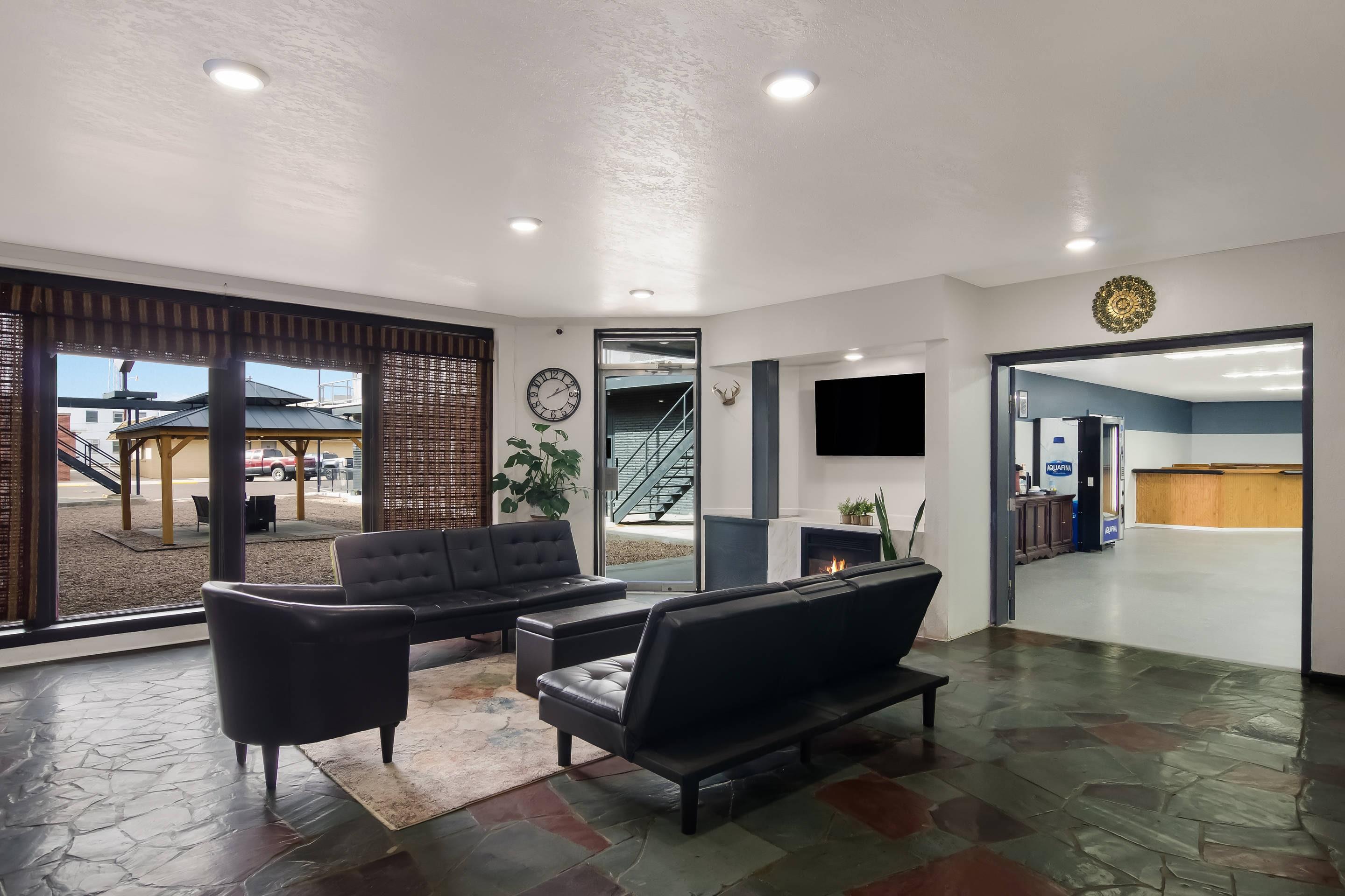 Spacious lobby with sitting area | Rodeway Inn & Suites