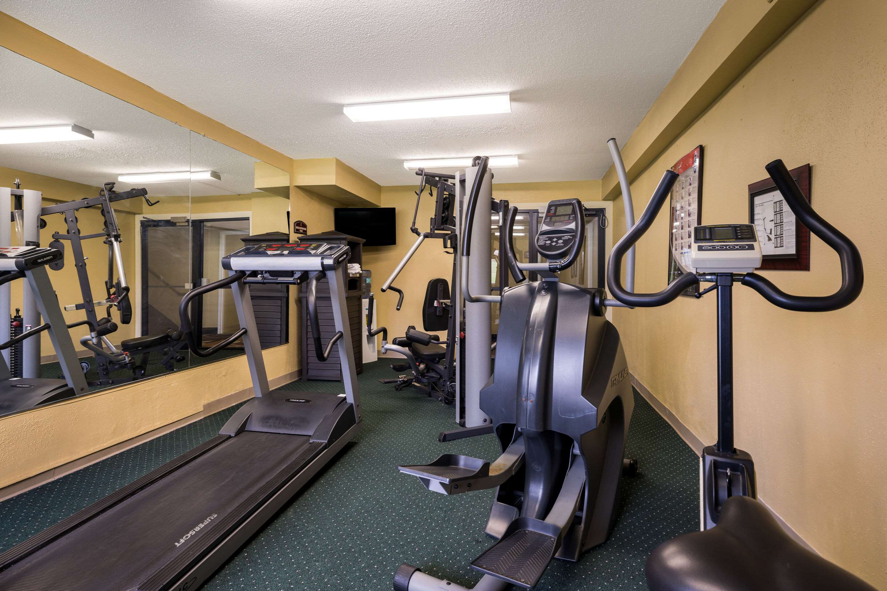 Exercise room with cardio equipment | Suburban Studios Syracuse Fairgrounds