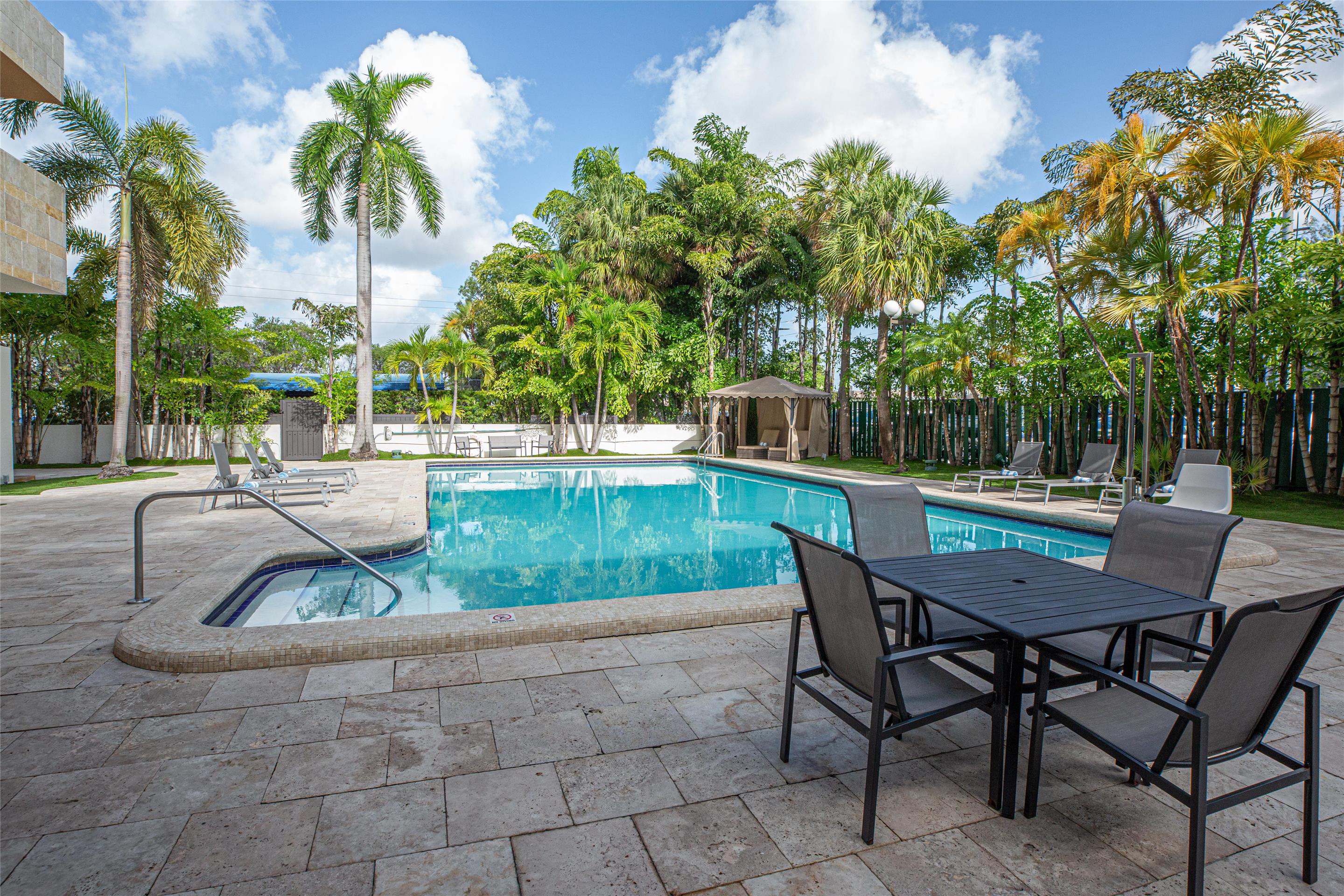 Outdoor Pool and Pool Tables | Regency Miami Airport by Sonesta