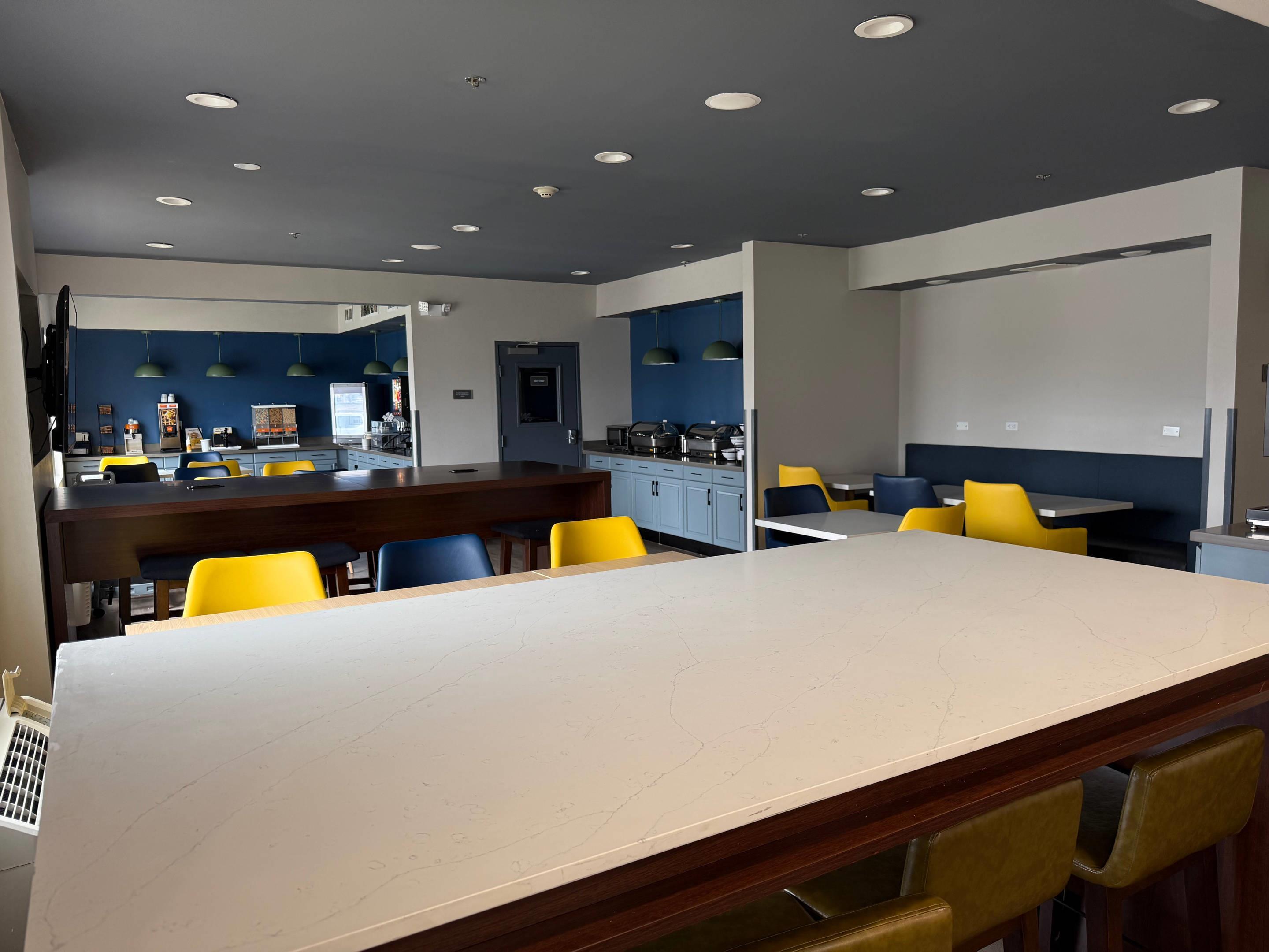 Enjoy breakfast in this seating area | Comfort Inn & Suites Olathe - Kansas City