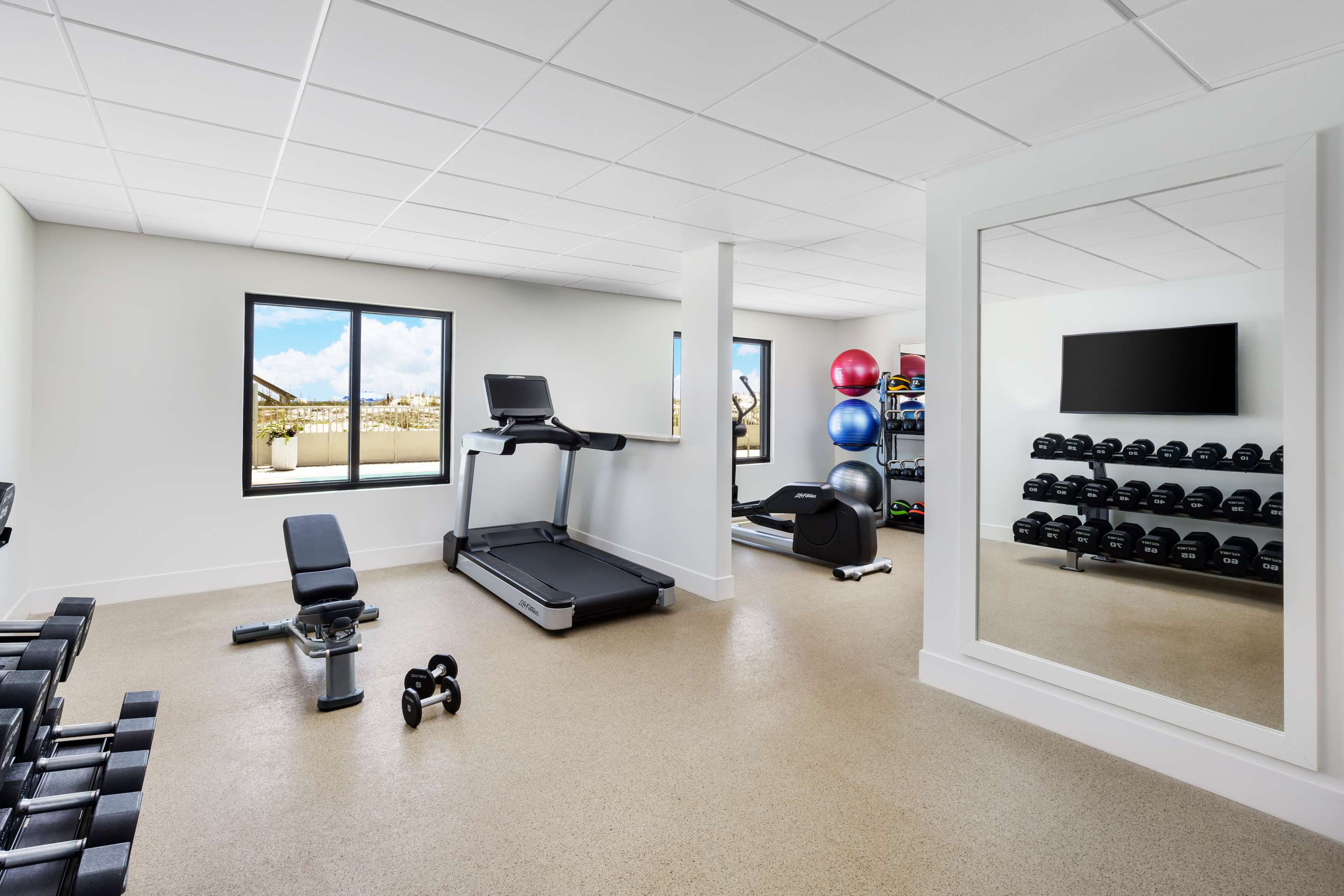 Health club fitness center gym | Beal House Fort Walton Beach, Tapestry Collection by Hilton
