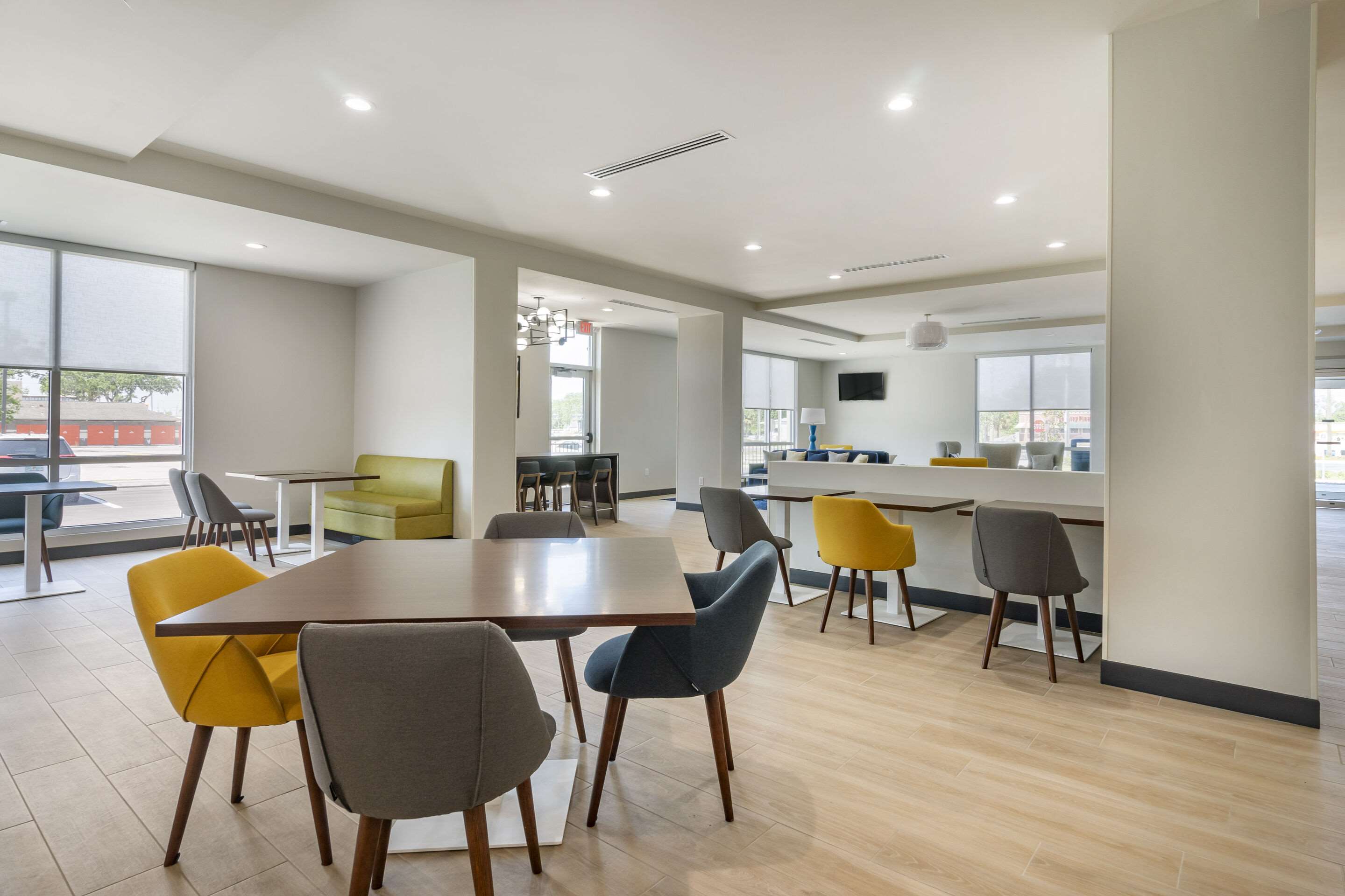 Enjoy breakfast in this seating area | Comfort Inn & Suites New Port Richey Downtown District