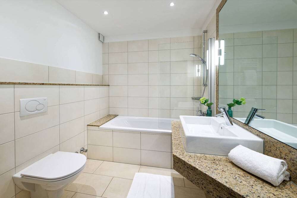 Stadthotel Borken by Hackmann-guestroom-Guest Room,Bathroom,On-Site.jpg