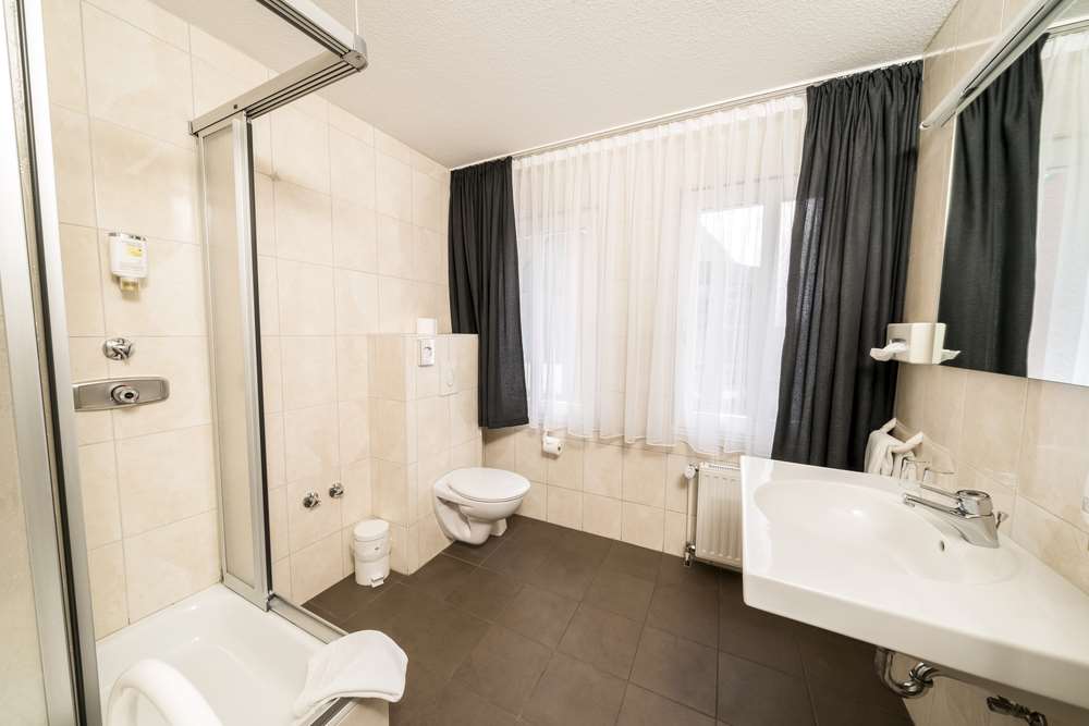 Parkhotel Lingen by Hackmann-guestroom-Guest Room,Bathroom,On-Site.jpg