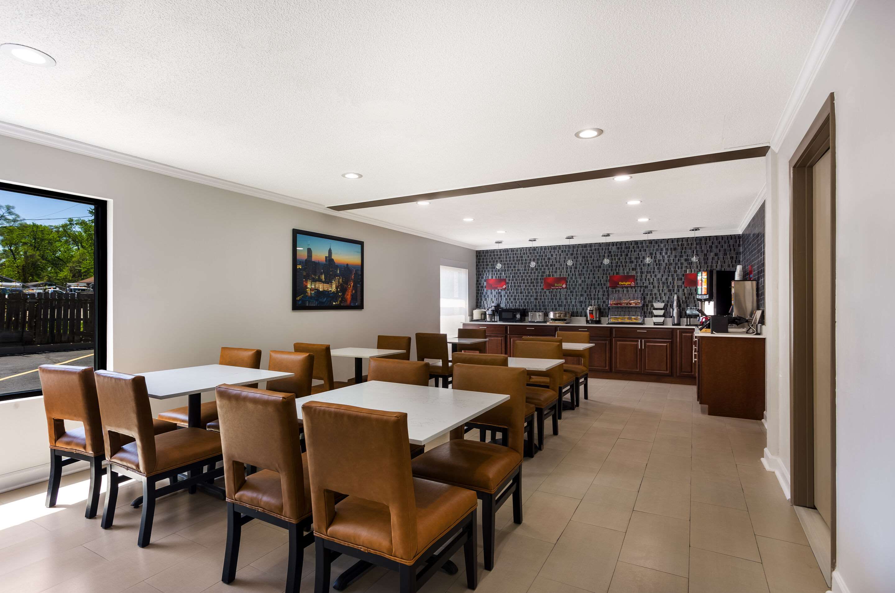 Enjoy breakfast in this seating area | Quality Inn South Bend Near Notre Dame