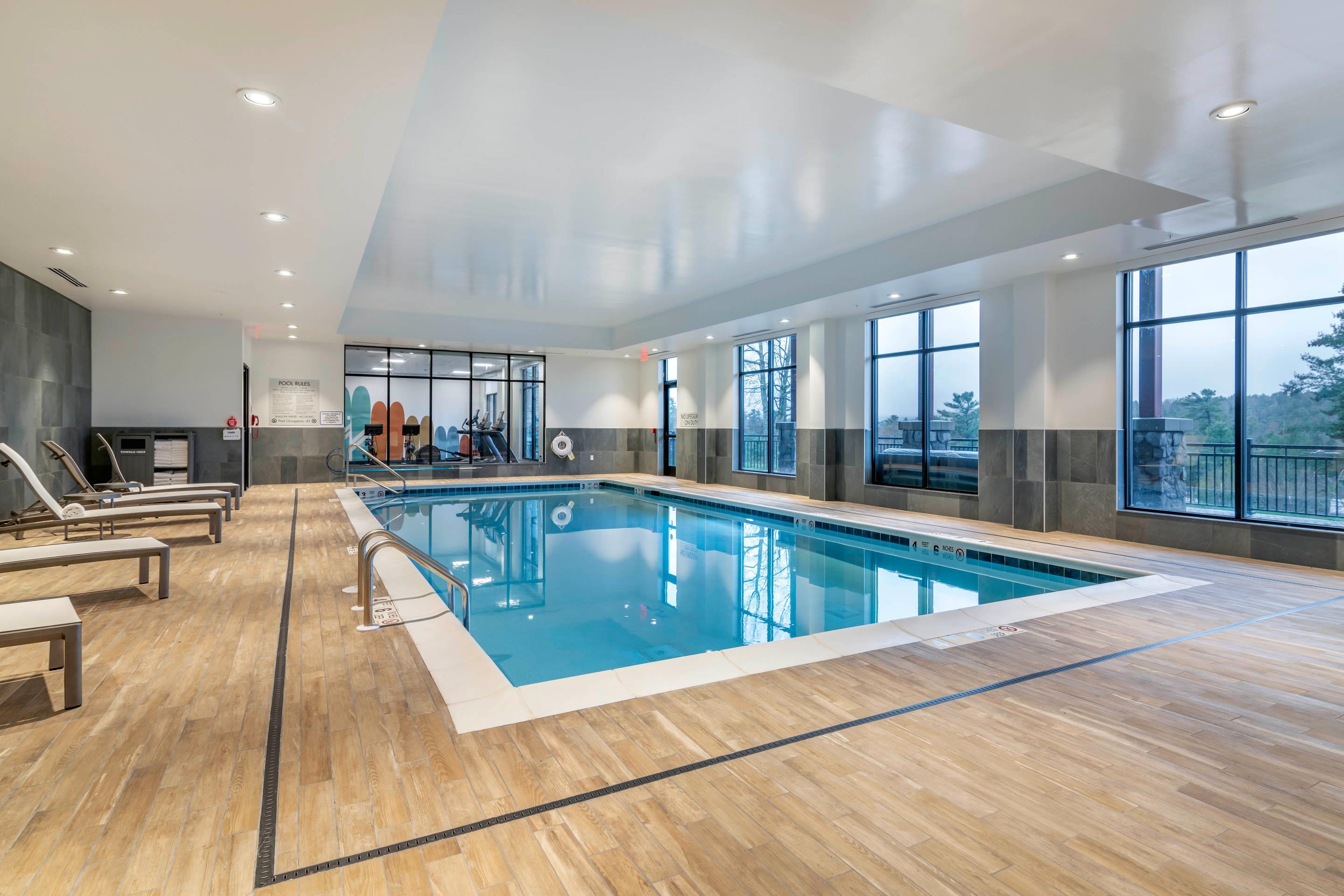 Relax by the pool | Cambria Hotel Lake Placid - Lakeside Resort