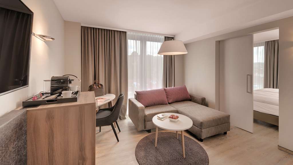 HOTEL STADT LOERRACH-guestroom-Guest Room,Living Area,Architecture,Indoor/Interior,On-Site,Décor detail,Summer,View from room,Exterior View of Building.jpg