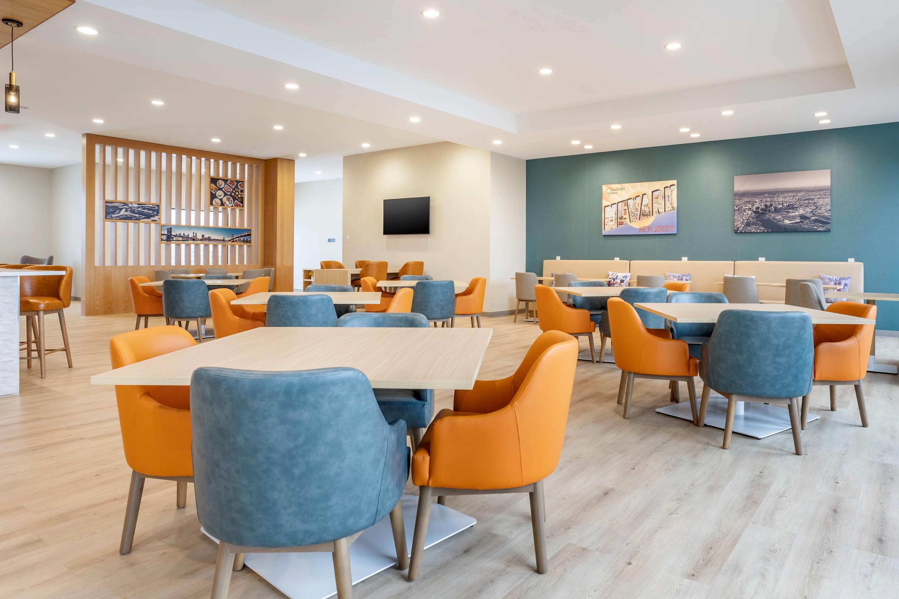 Enjoy breakfast in this seating area | Comfort Inn & Suites Newark Liberty International Airport