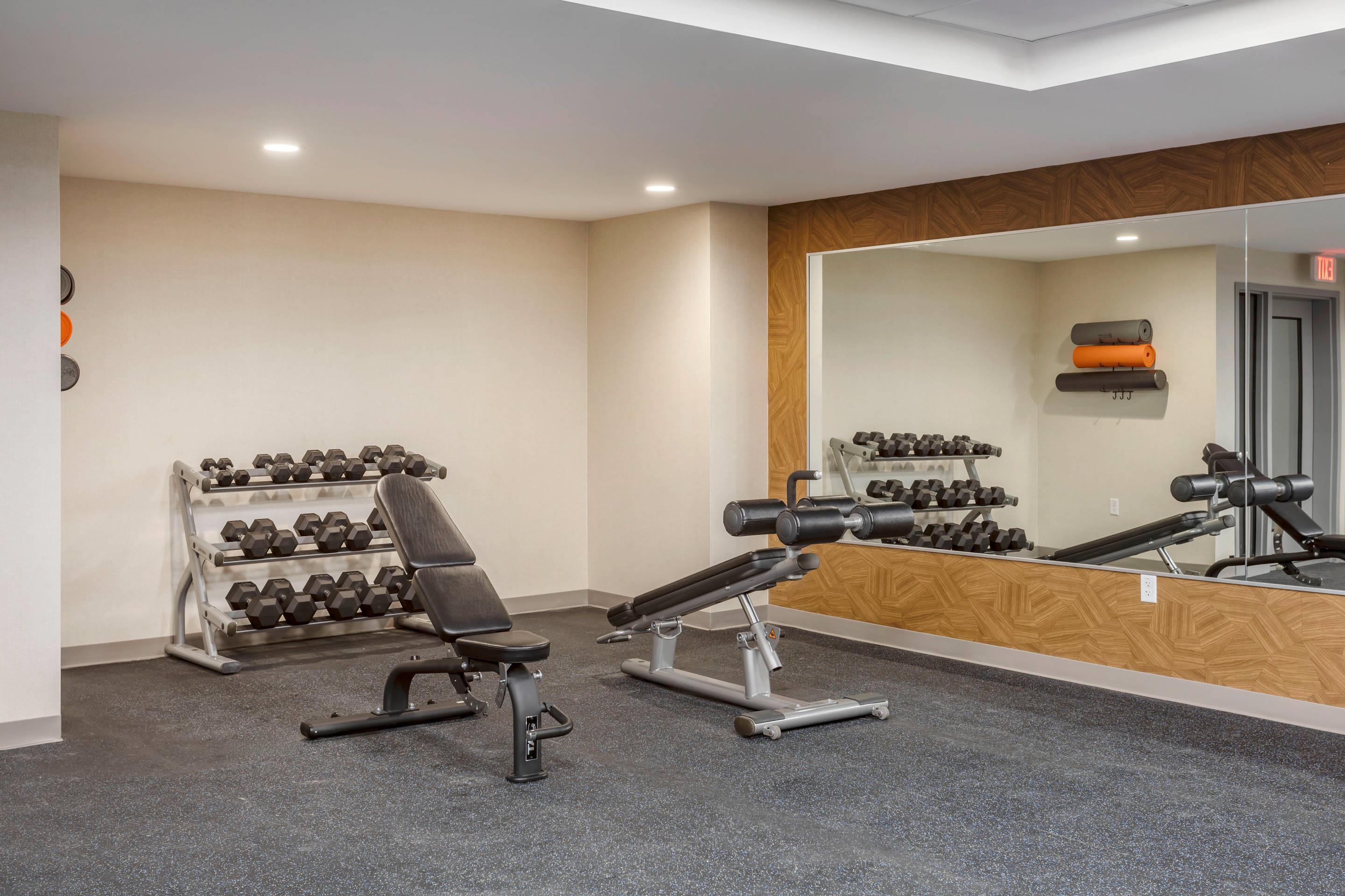 Exercise room with cardio equipment and weights | Comfort Inn & Suites Newark Liberty International Airport