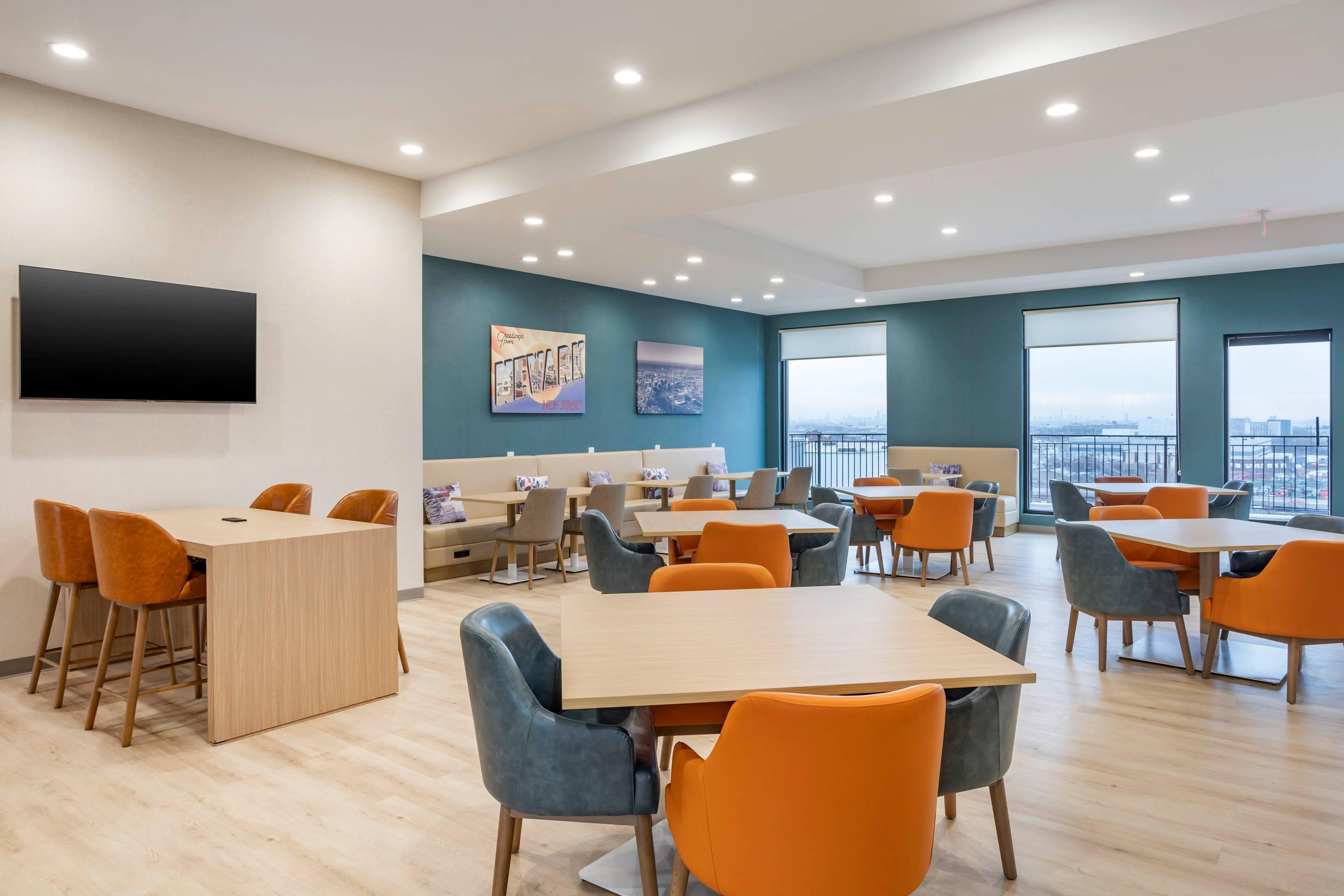 Enjoy breakfast in this seating area | Comfort Inn & Suites Newark Liberty International Airport