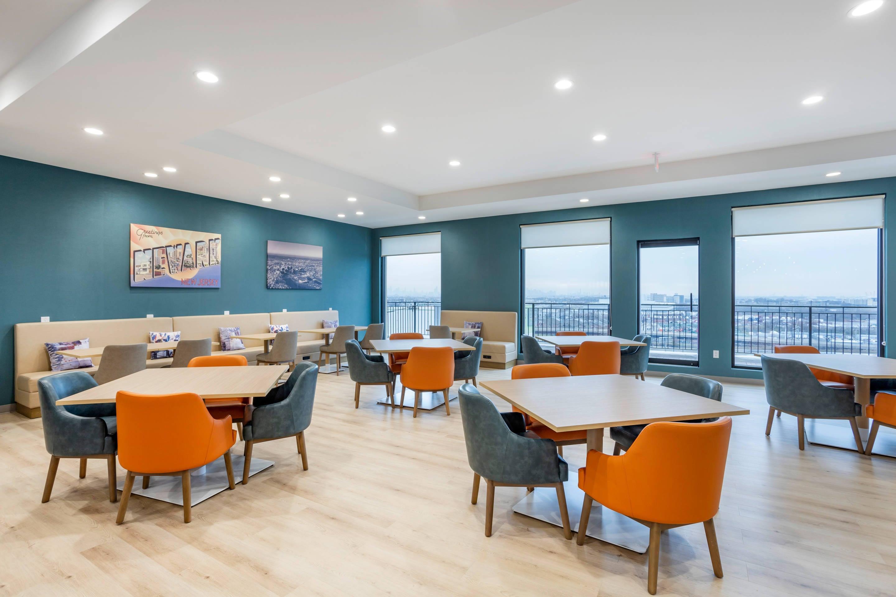 Enjoy breakfast in this seating area | Comfort Inn & Suites Newark Liberty International Airport