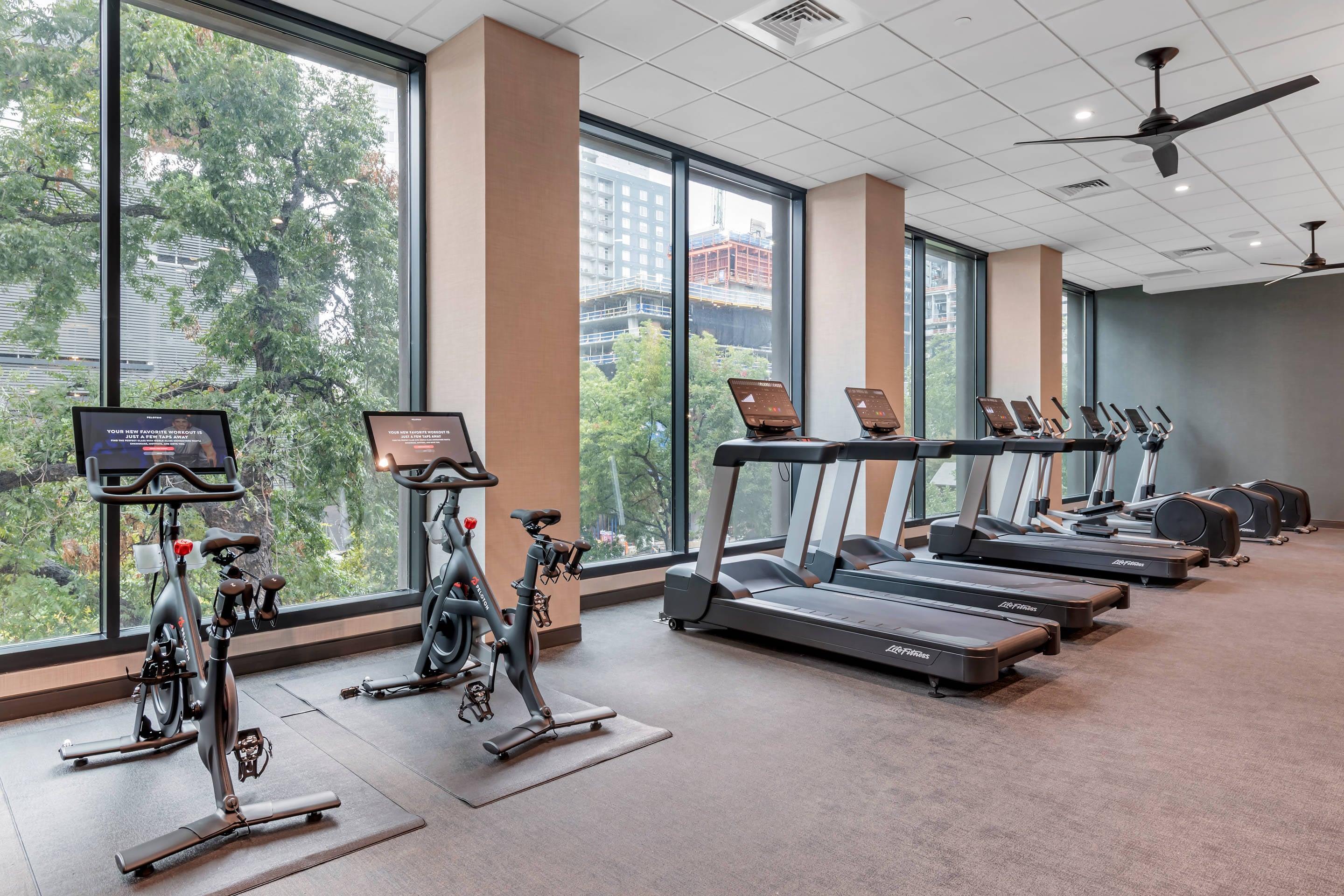 Exercise room with cardio equipment and weights | Cambria Hotel Austin Downtown